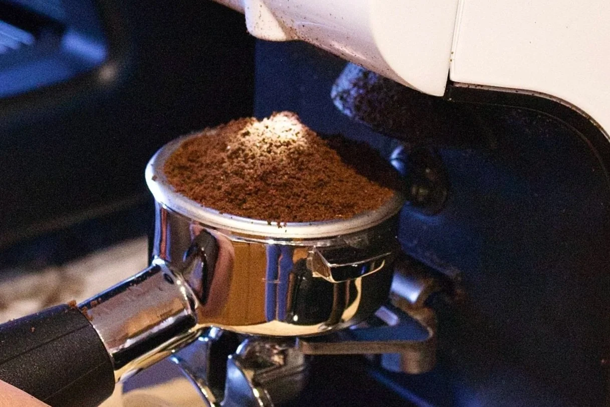 Fresh espresso grounds in a portafilter at Milk n Honey Coffee Company’s mobile coffee cart, serving handcrafted drinks at Minneapolis and Twin Cities events.
