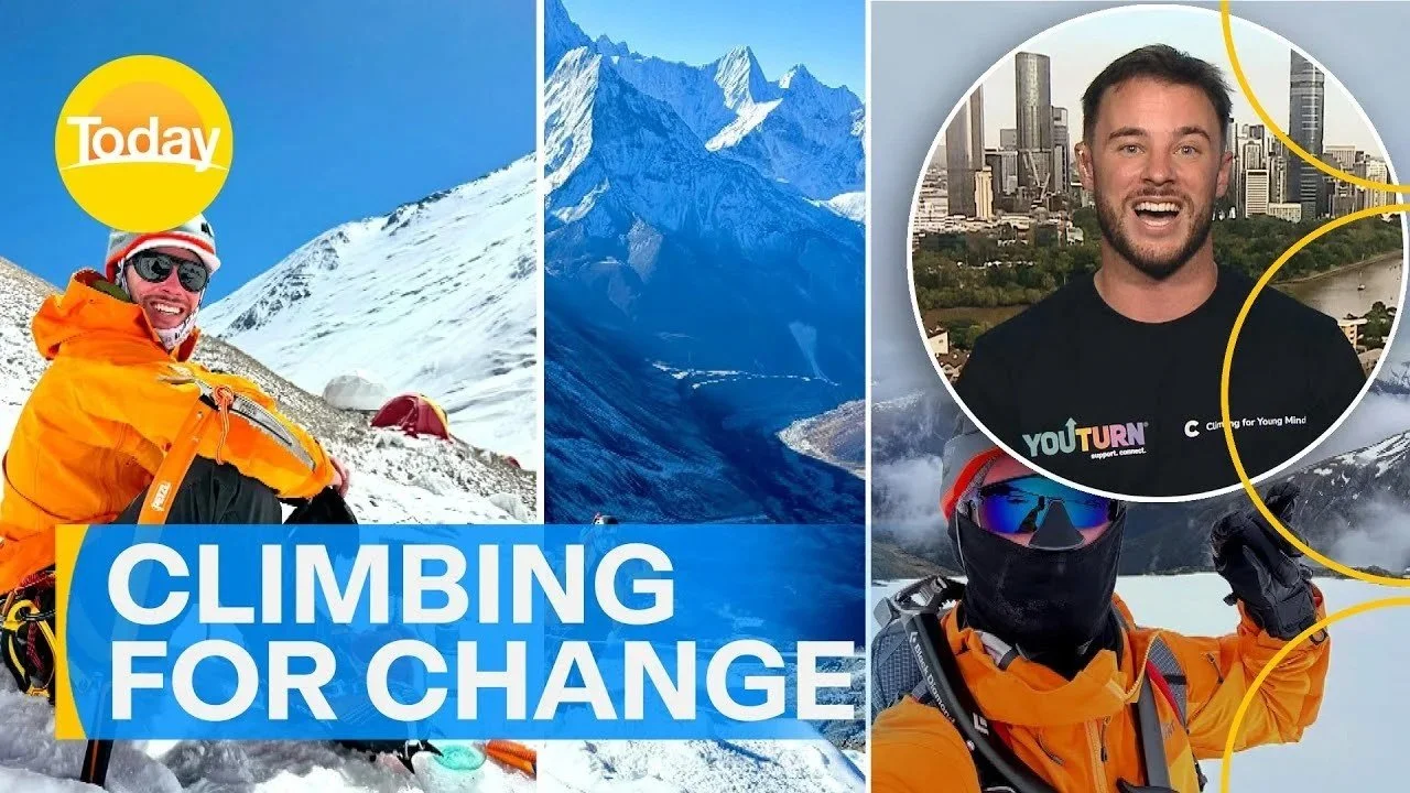 Composite image showing a climber in an orange jacket and black face covering, standing on snow with mountains in the background, the logo 'Today' in the top left corner, and text 'Climbing for Change' across the bottom. An inset photo of a smiling man with a cityscape background and the 'YouTurn' logo appears on the top right.
