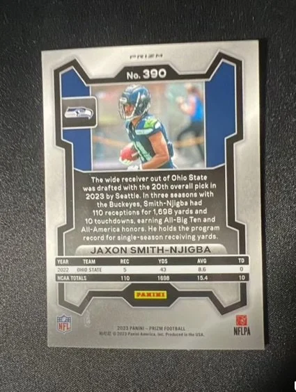Football trading card featuring Jaxon Smith-Njigba from Ohio State, with player stats and a photo of him in uniform.