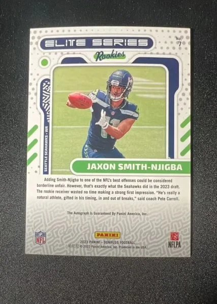 Football trading card of Jaxon Smith-Njigba from the 2023 Panini Donruss Football series, featuring an action shot of him in a Seattle Seahawks uniform.