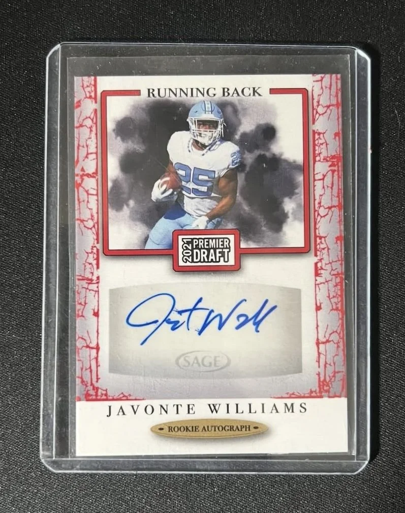 Sports trading card featuring Javonte Williams, a rookie running back, with an autograph, from the 2021 Premier Draft series.