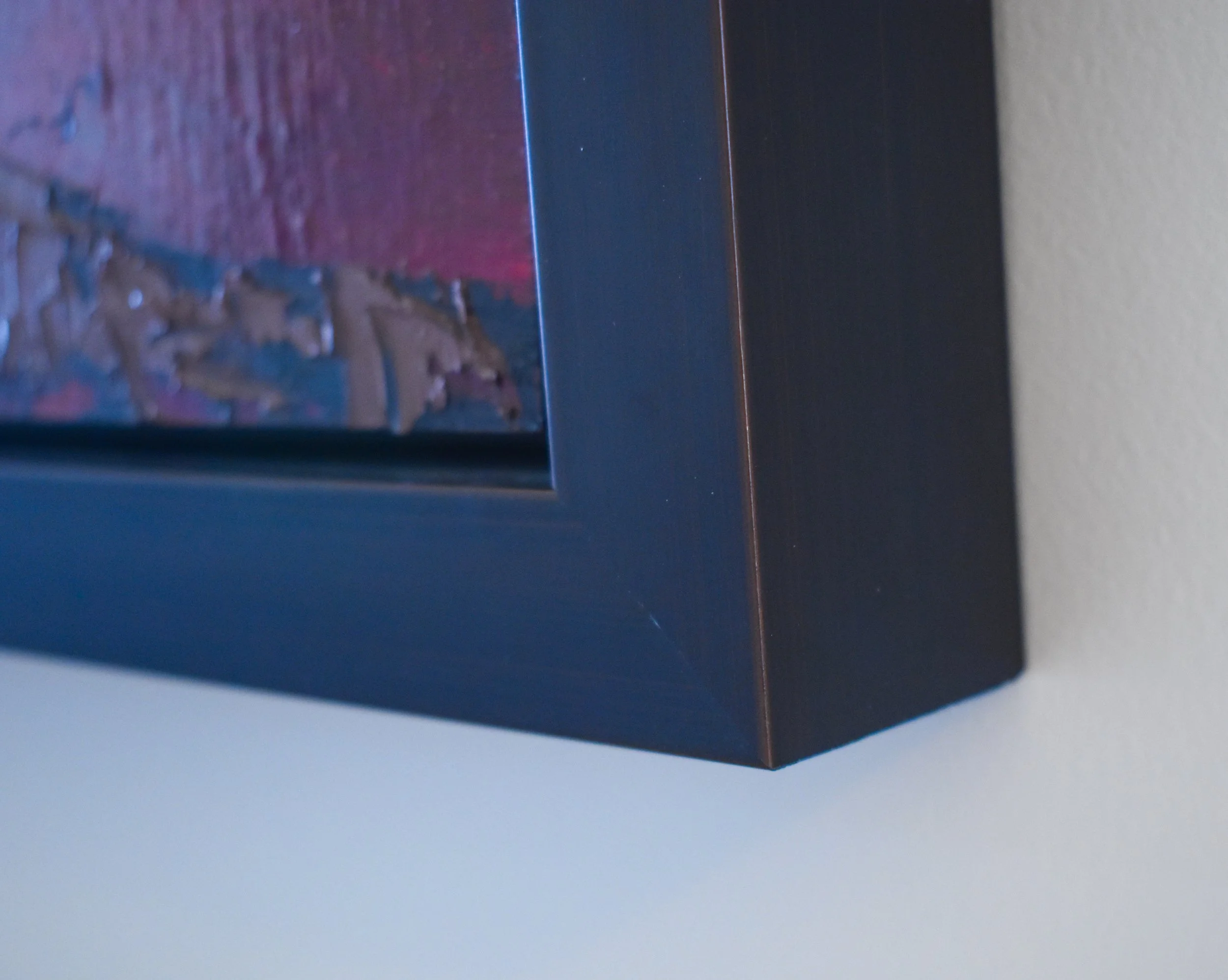 Corner detail of the museum-quality dark espresso frame surrounding the original oil painting Path Through The Storm by Kelly Sooter.