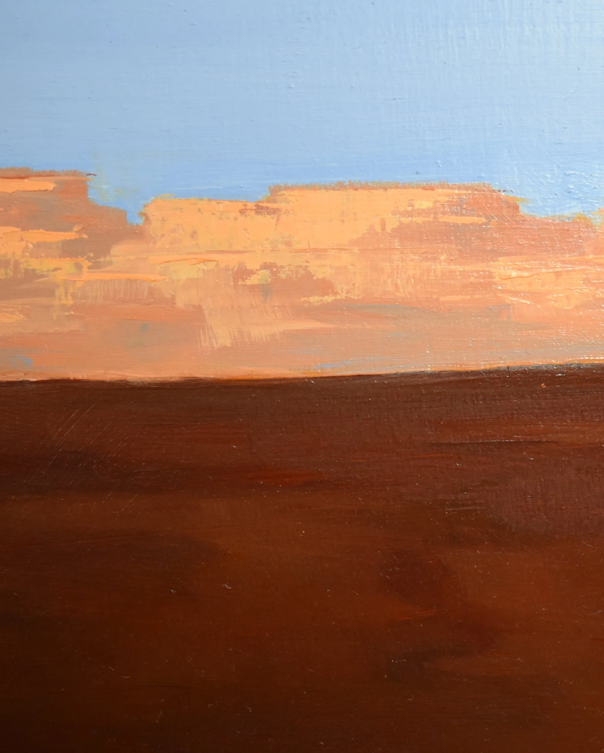 Close-up detail of Making A Statement by Kelly Sooter, highlighting layered oil paint, luminous desert cliffs, rich earth tones, and the subtle surface texture of the original painting.