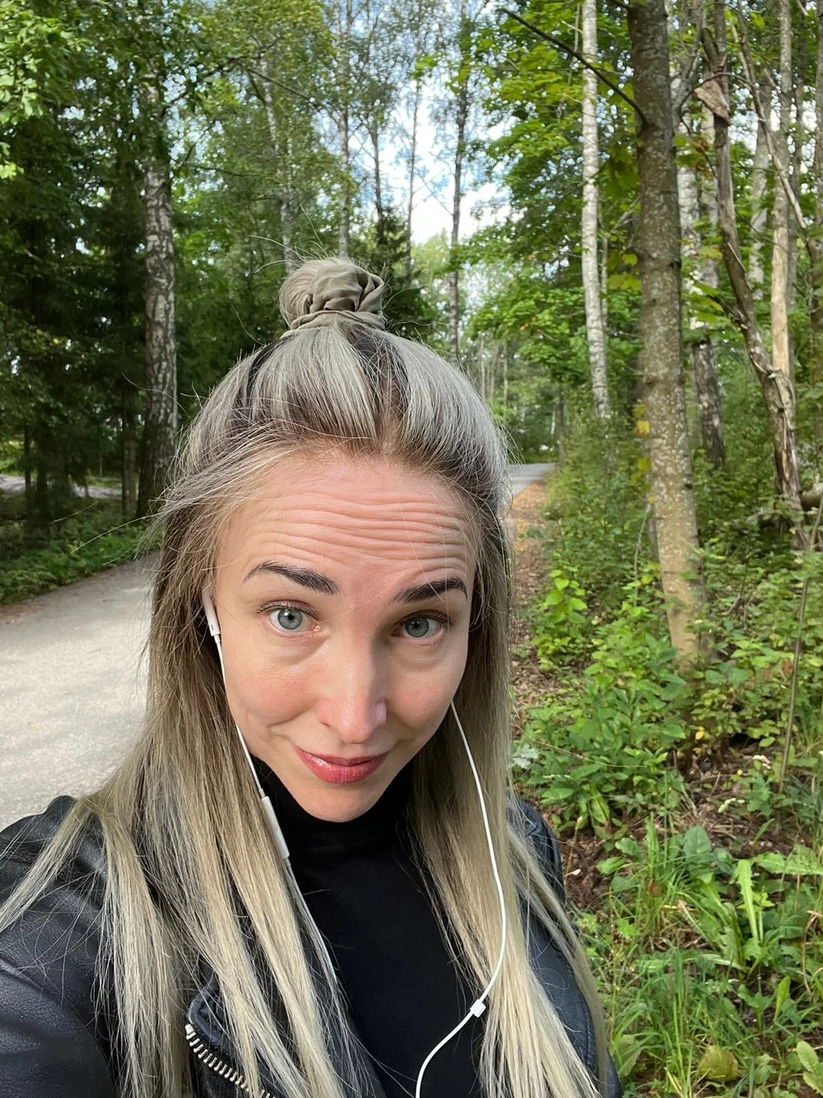 A woman with long blond natural looking hair
