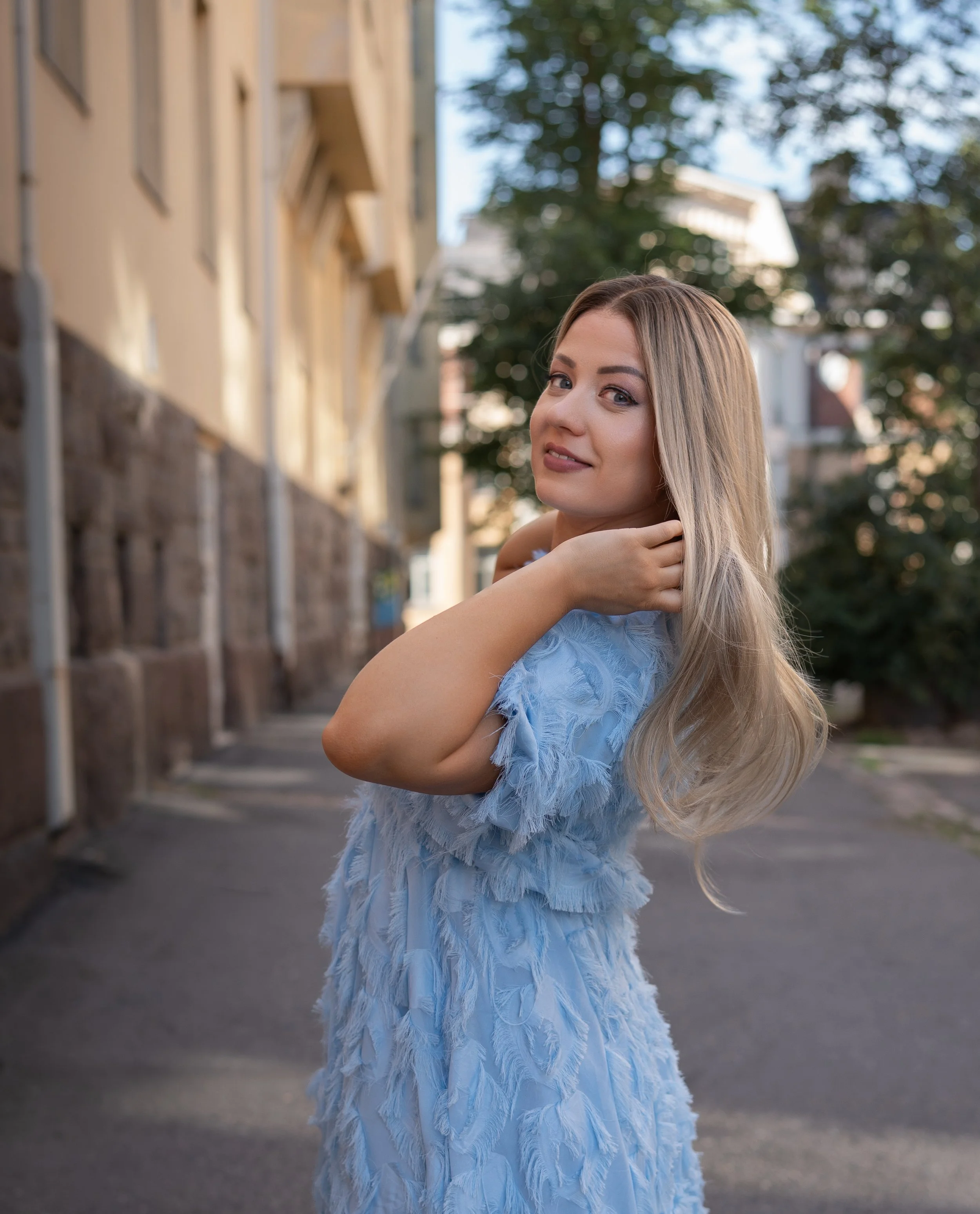 A young woman with long blonde natural wig