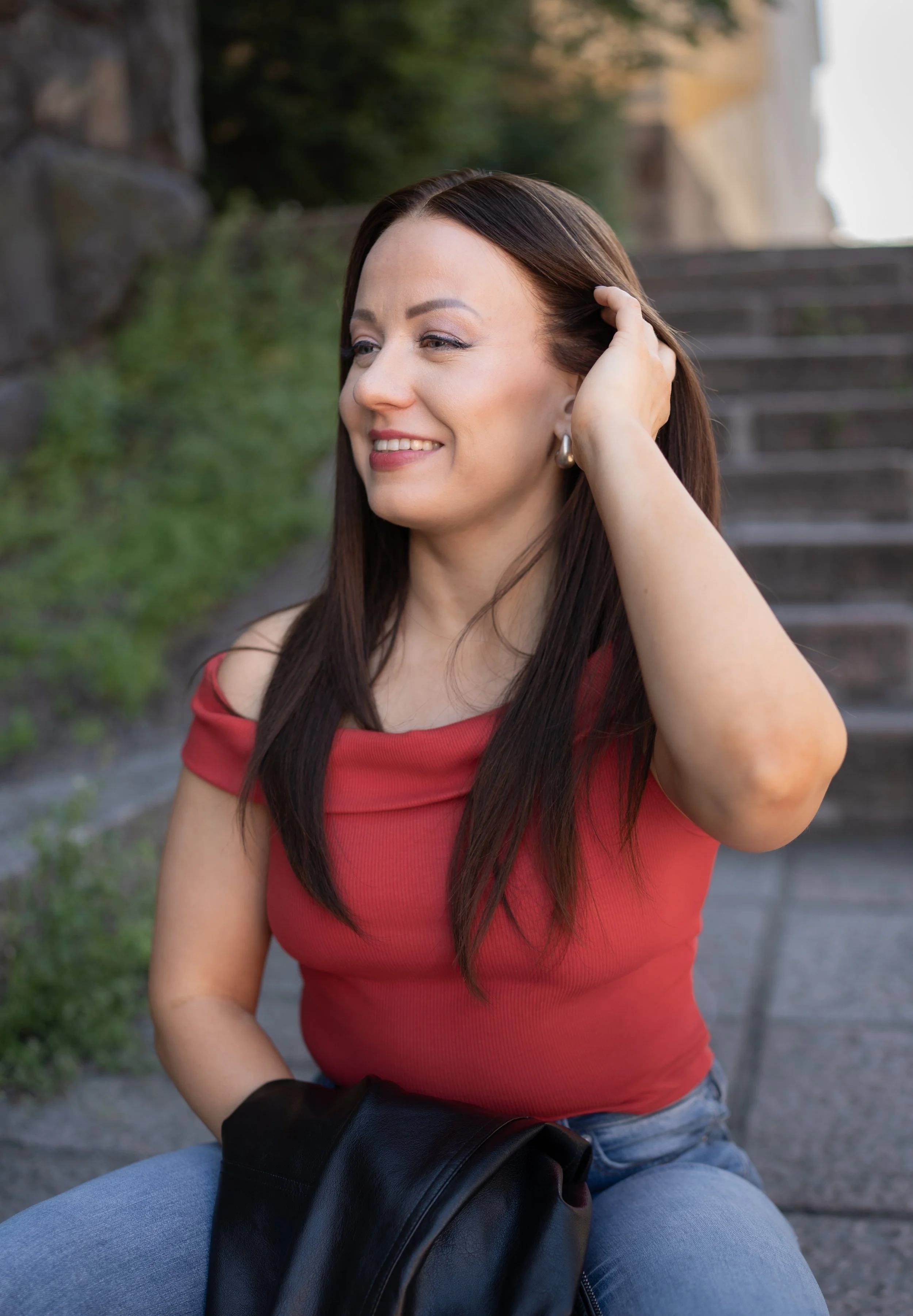 A woman with long dark, natural looking hair wig