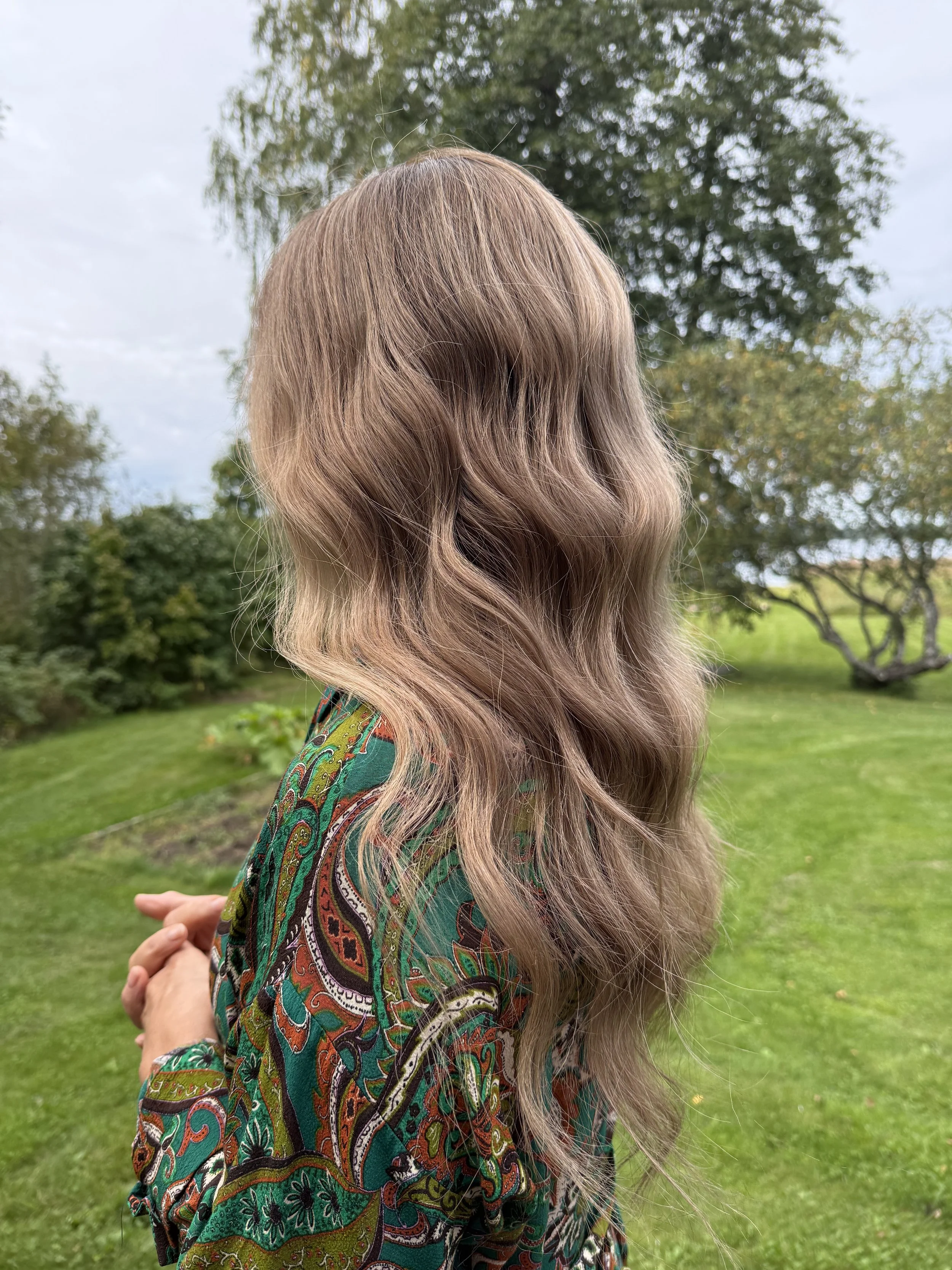 Long, wavy light brown human hair wig