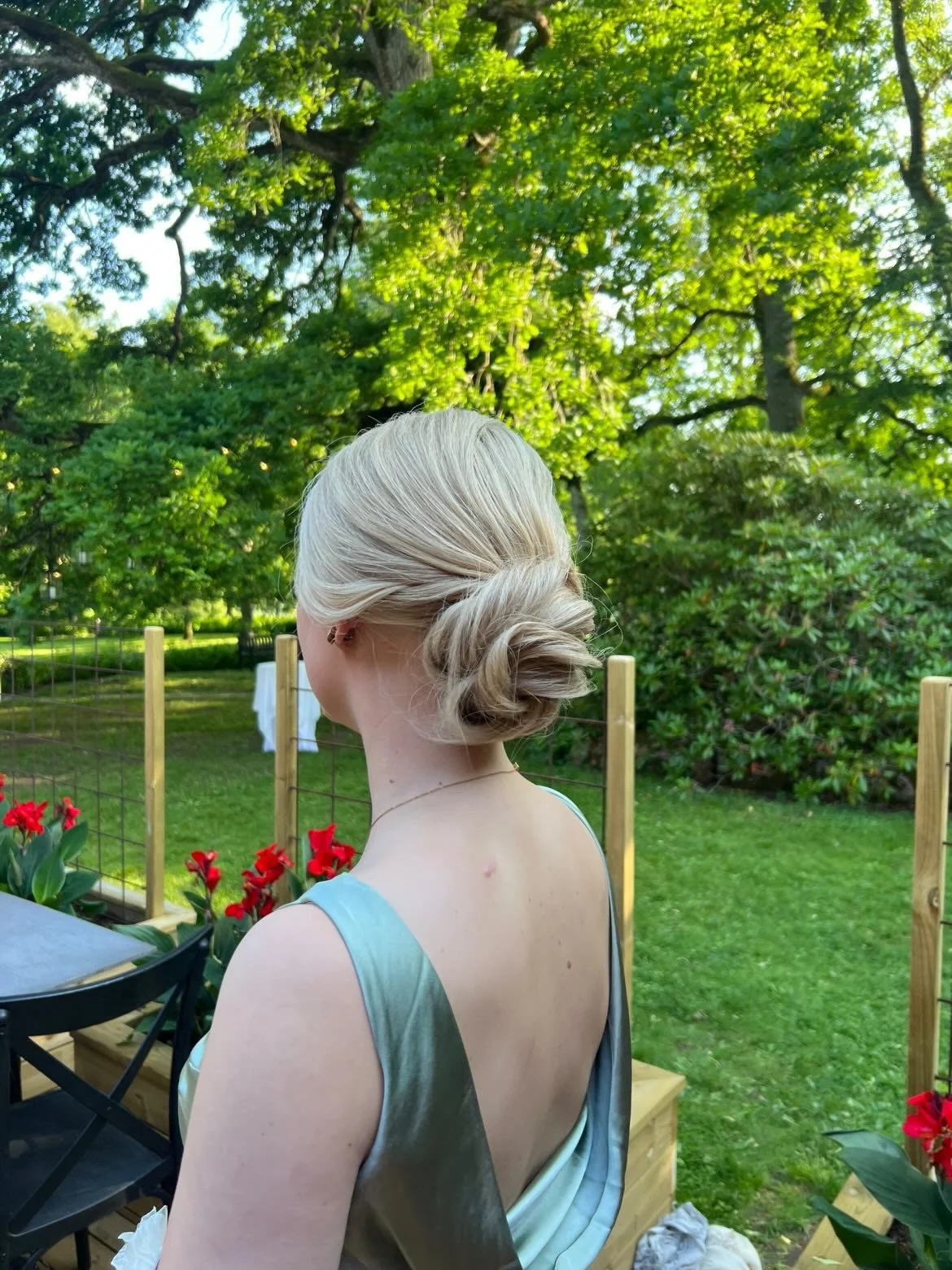 Blonde wig styled in a loose bun 