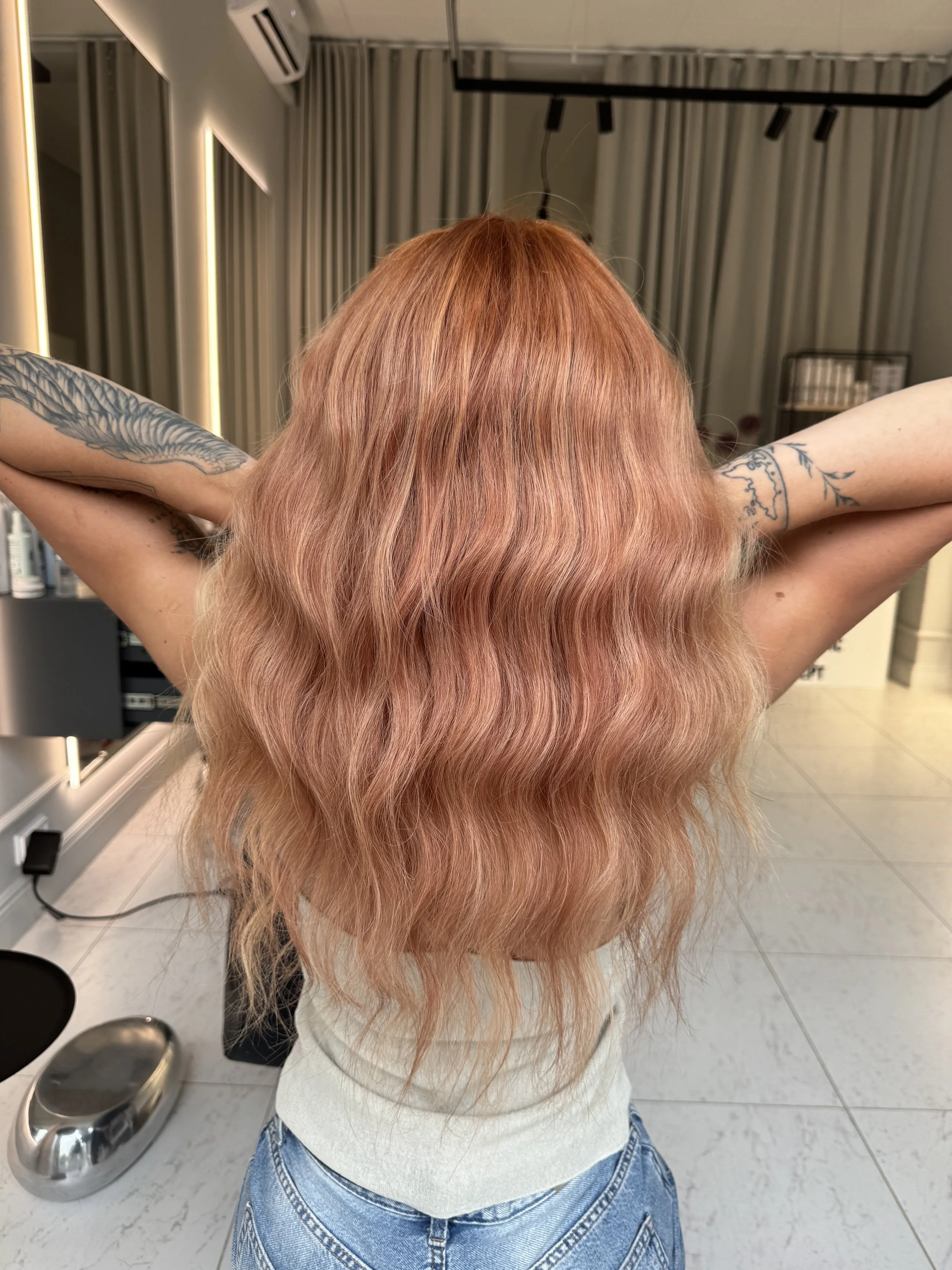 Wavy reddish-blonde hair wig