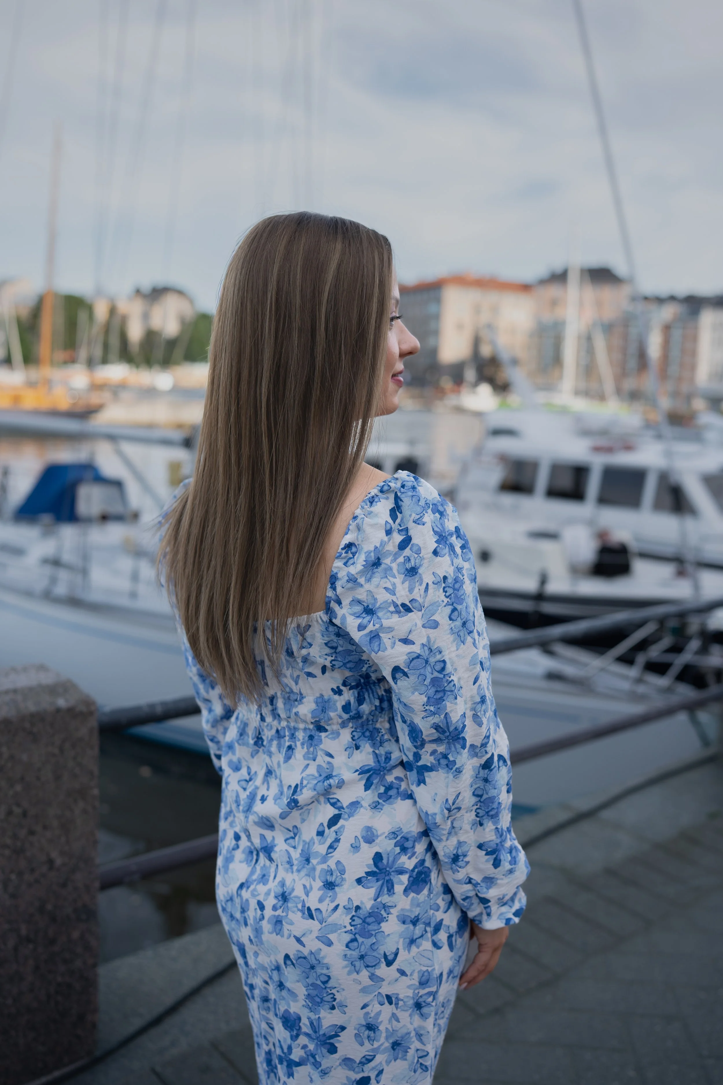 A woman with long brown hair natural wig