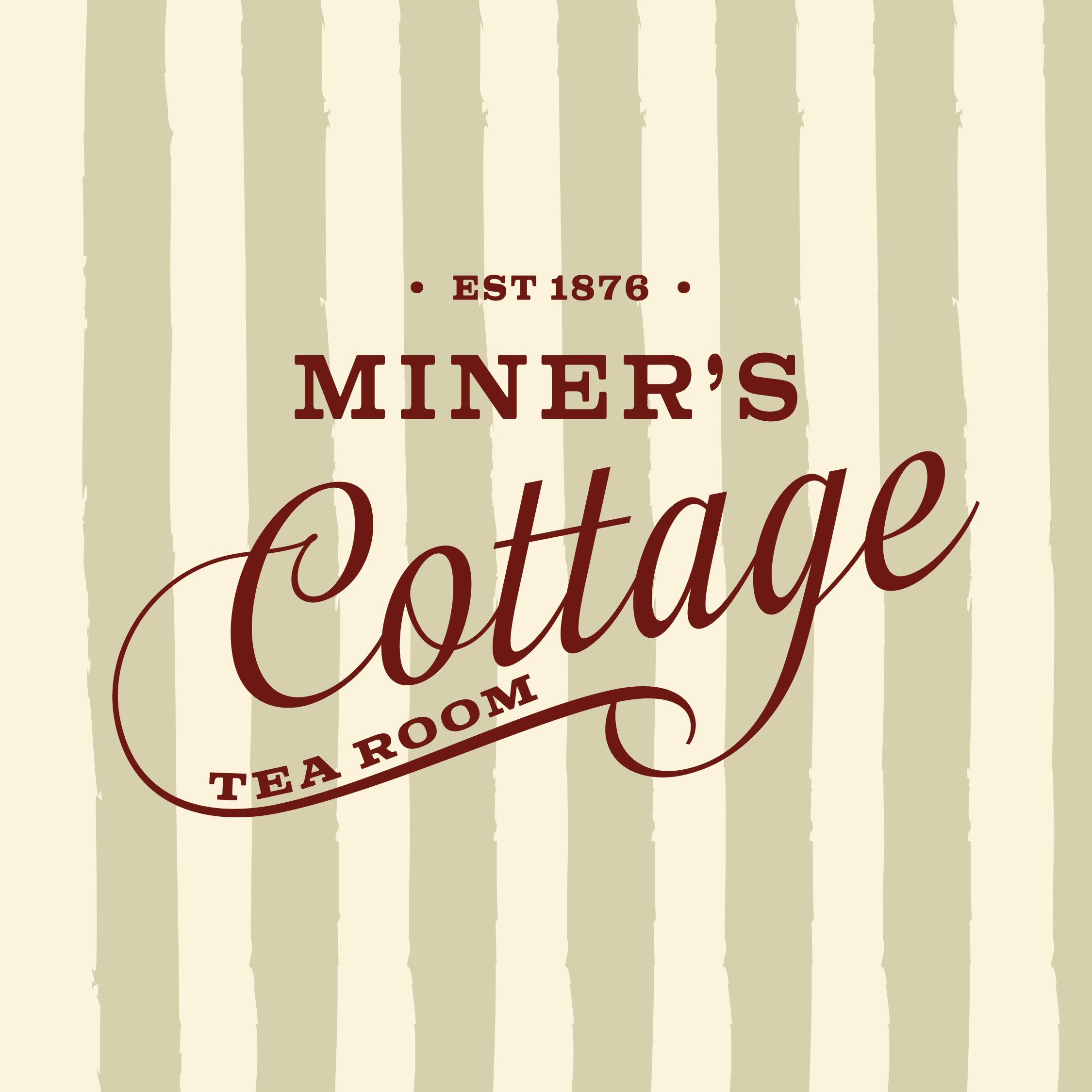 Sign for Miner's Cottage tea room, established in 1876, with a background of vertical beige and light green stripes.