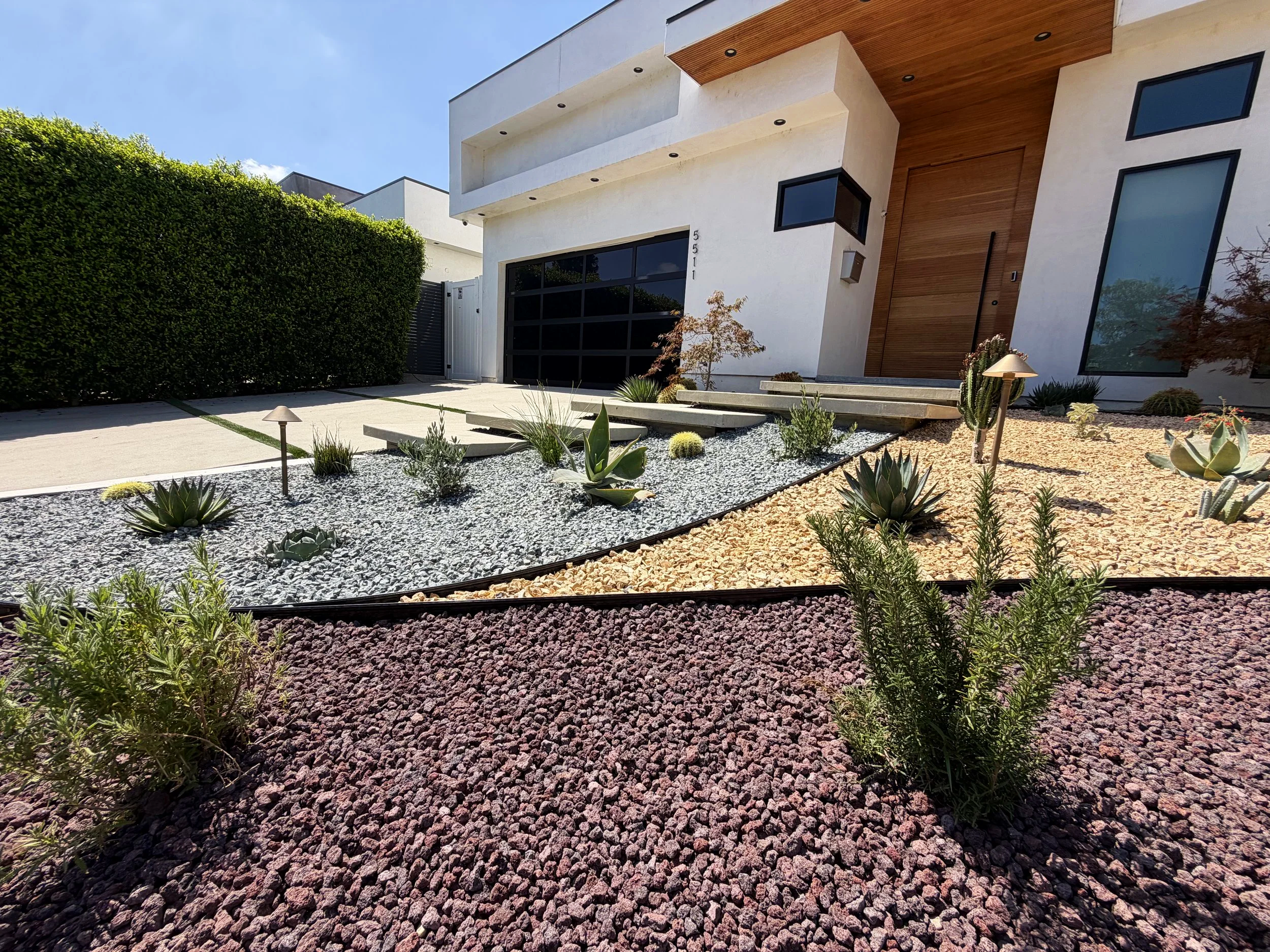 contemporary drought tolerant landscape design in Los Angeles with different colored gravel