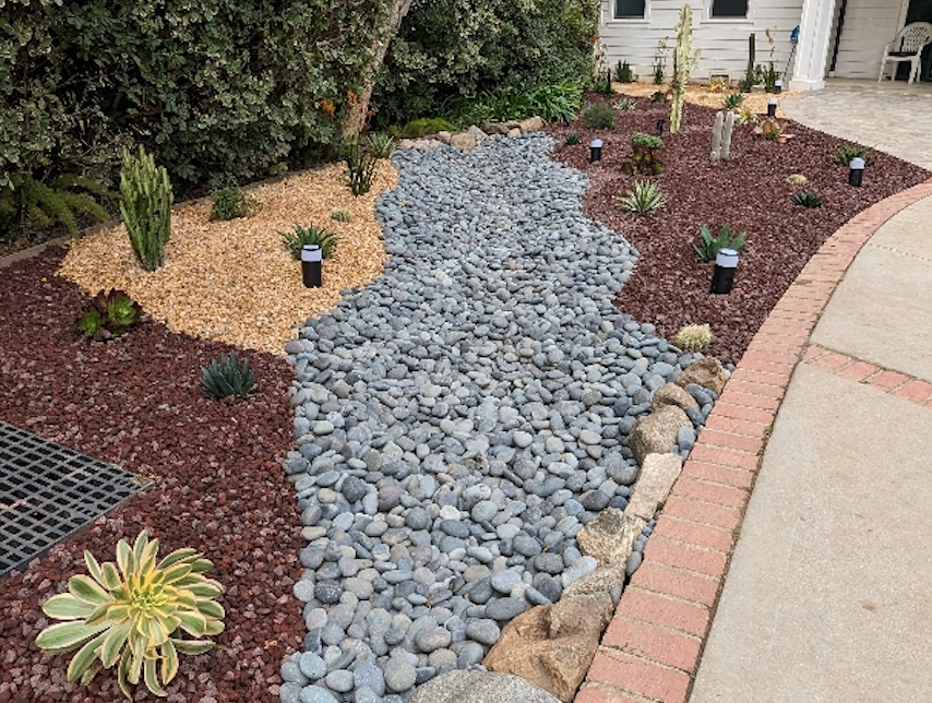 drought tolerant landscape in Los Angeles with xeriscape and dry river bed
