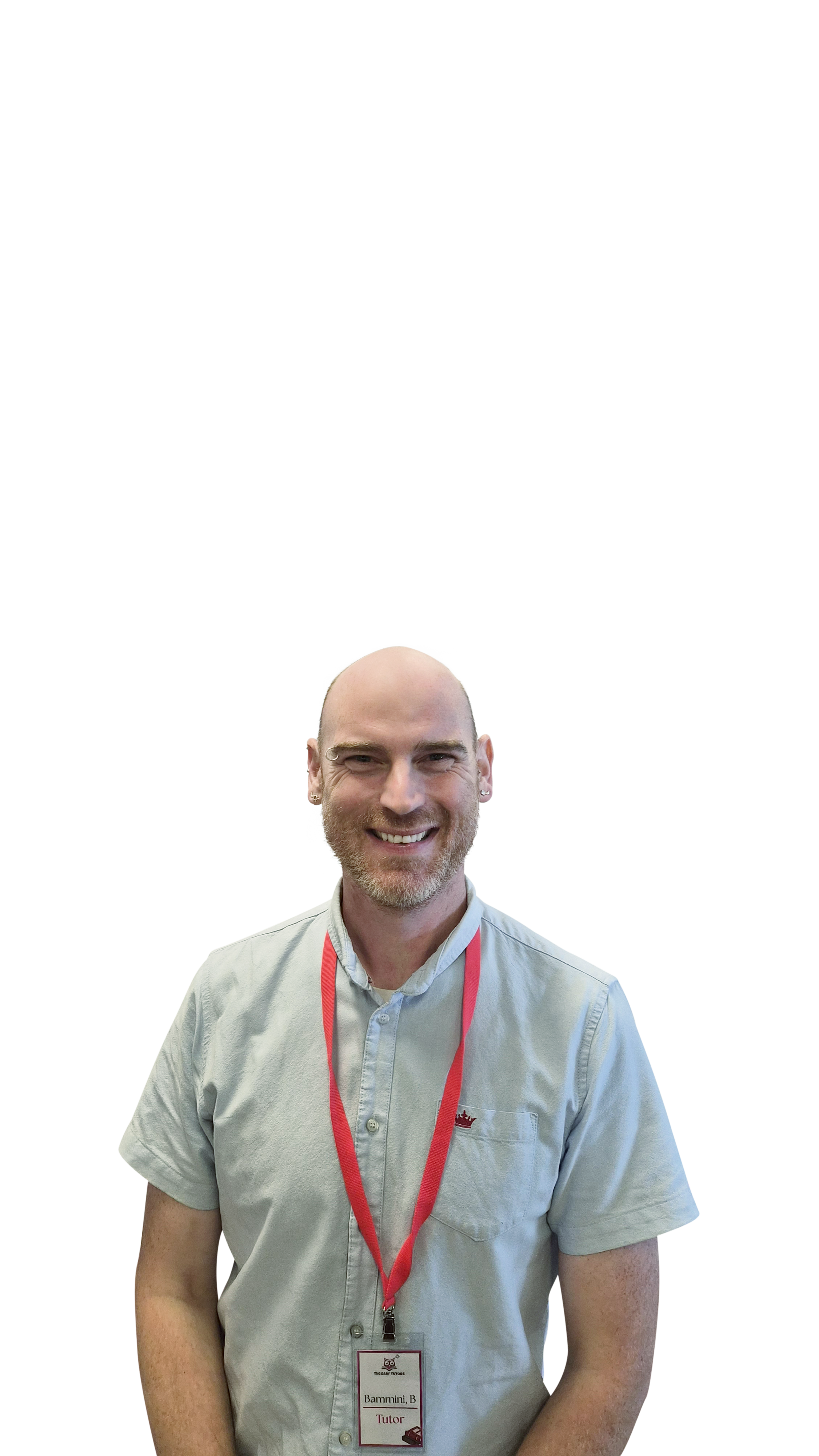 A smiling man with a beard and bald head wearing a light gray short-sleeved shirt with a red lanyard and name tag.