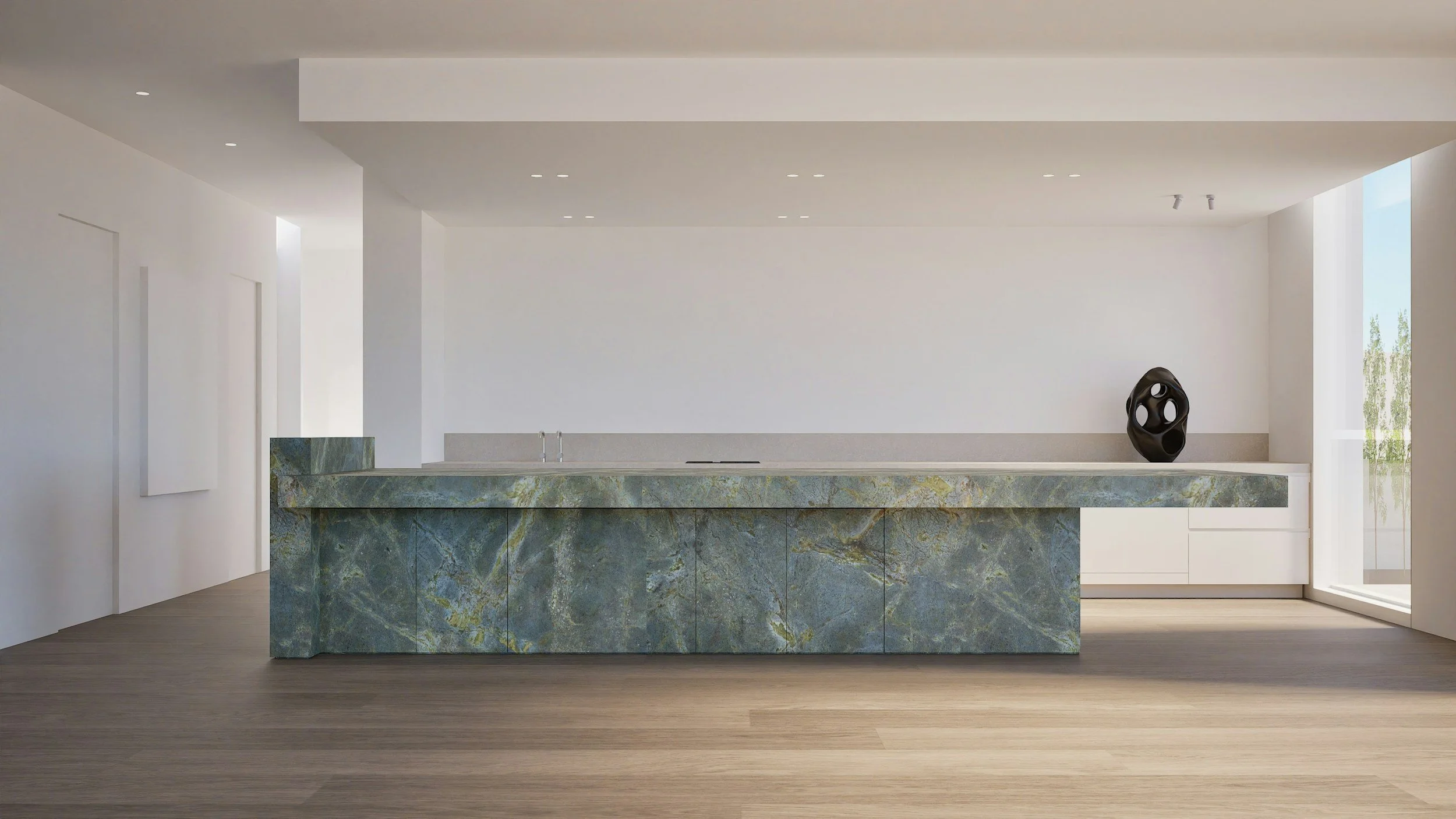 Modern kitchen with marble island, white walls, and a black sculpture on the countertop, illuminated by natural light from large windows.