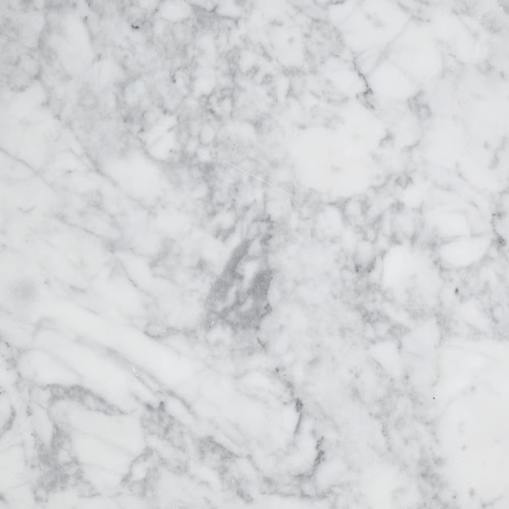 Close-up of white marble surface with gray veining.
