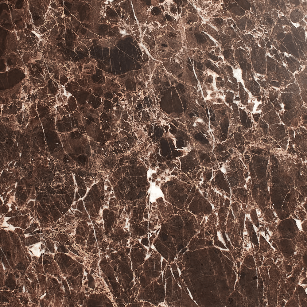 Close-up of a dark brown marble surface with white veins.