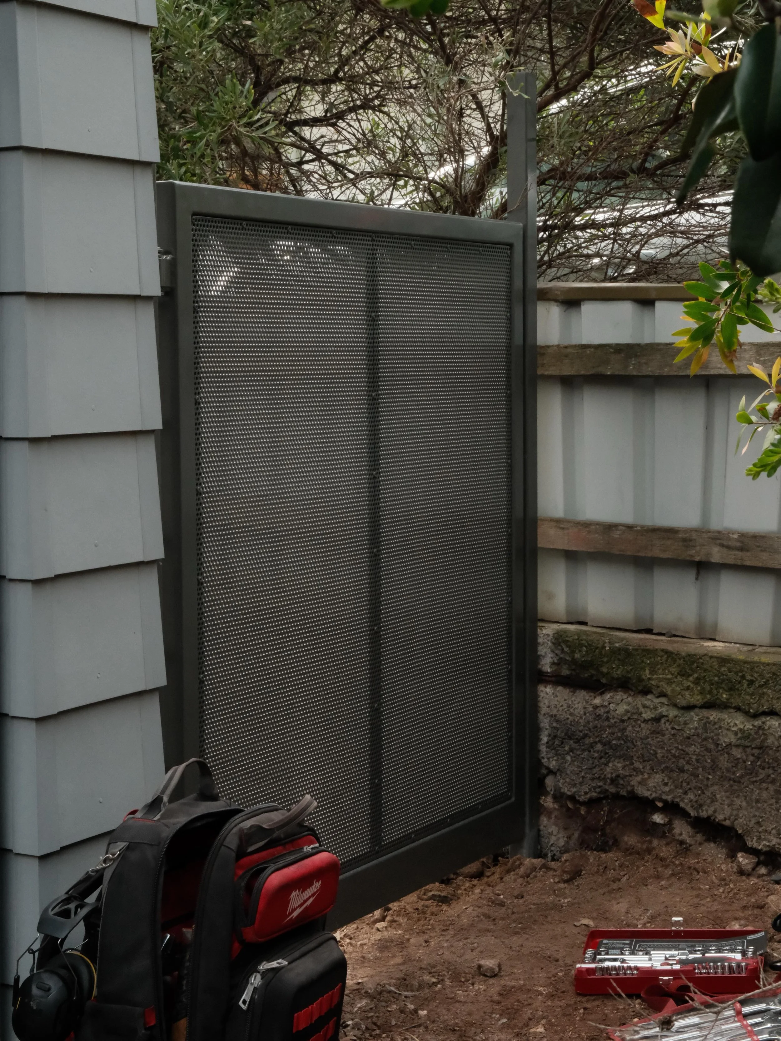 Recent gates designed, fabricated and installed.

Full aluminium construction including perforated mesh infills and stainless fixings, finished in Monument powder coat.

Designed to suit the coastal environment in Port Elliot using durable components