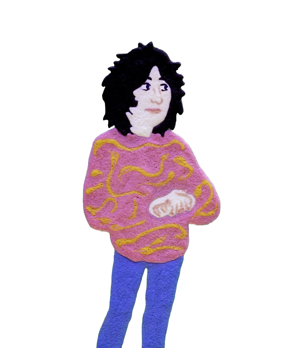 A cartoon figurine with black curly hair, wearing a pink hooded sweatshirt with yellow squiggly lines and blue pants, standing with arms crossed.
