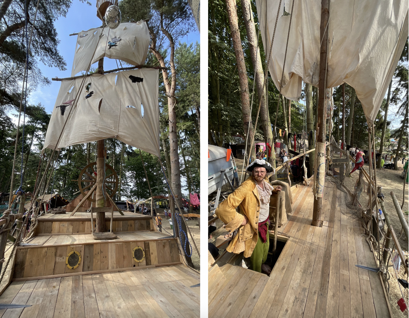 A wooden pirate ship with white fabric sails tied to wooden poles, set up outdoors among trees, with people dressed in pirate costumes around it.