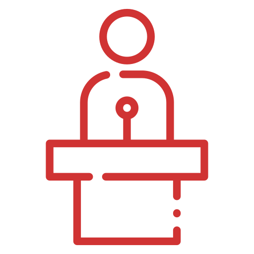 In Your Corner red icon of person speaking at a podium, representing who their services are for