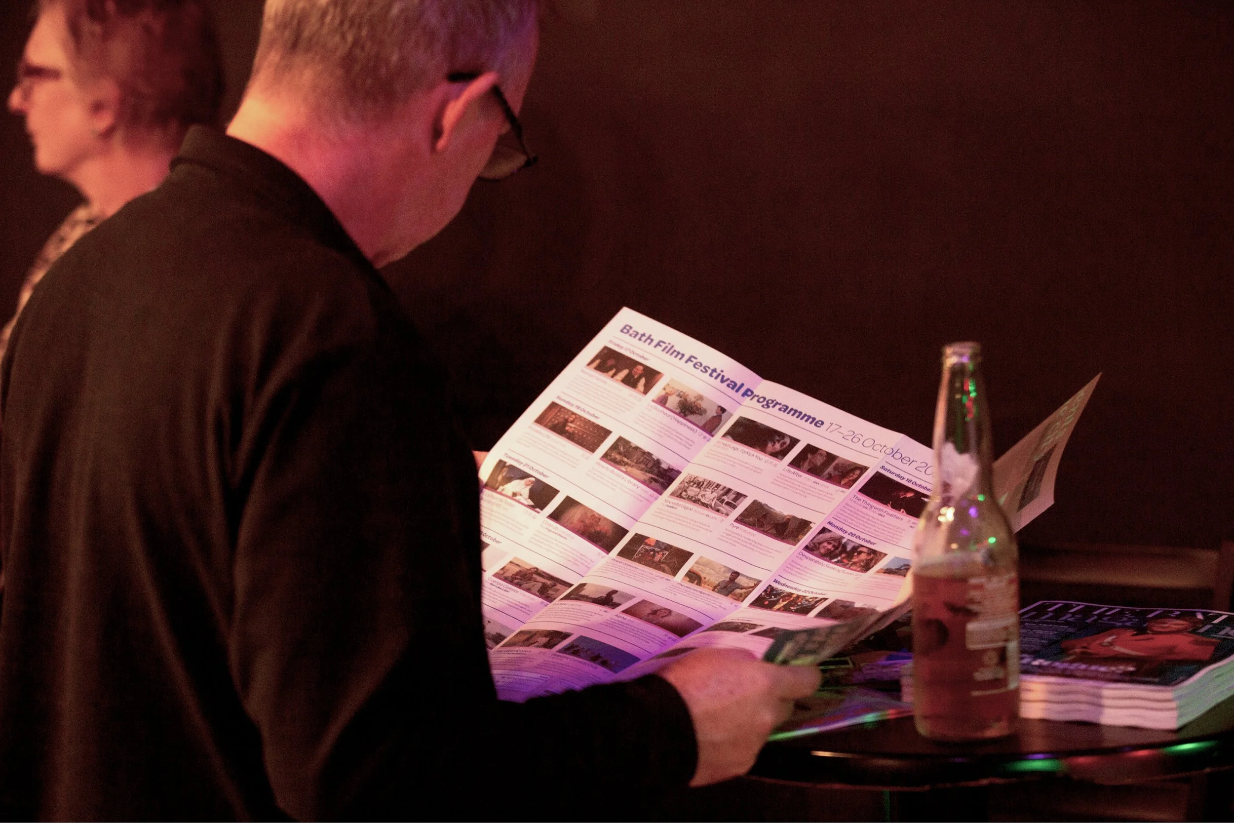 A guest reading the Bath Film Festival programme at the launch event.