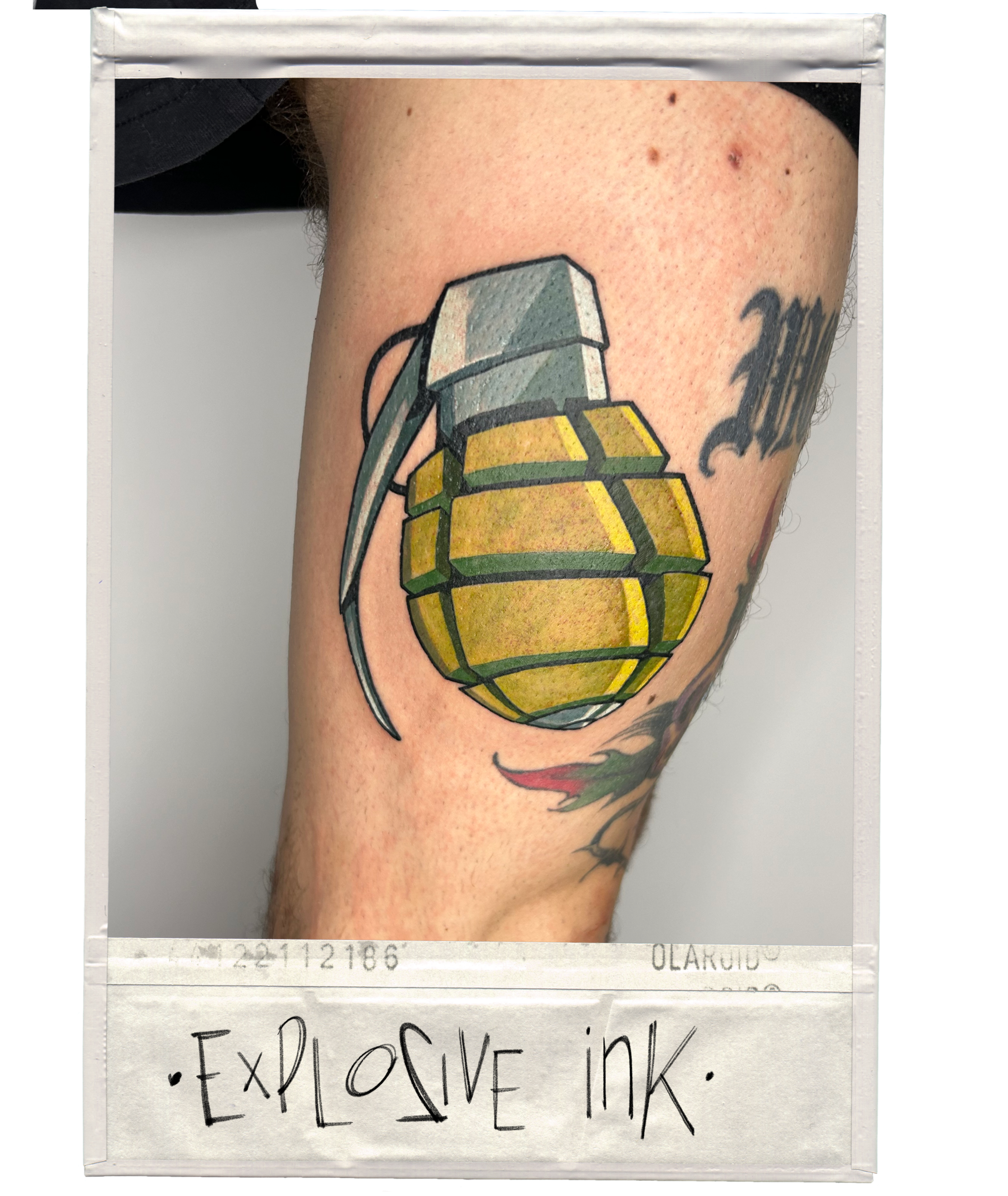 Tattoo of a hand grenade on a person's arm.