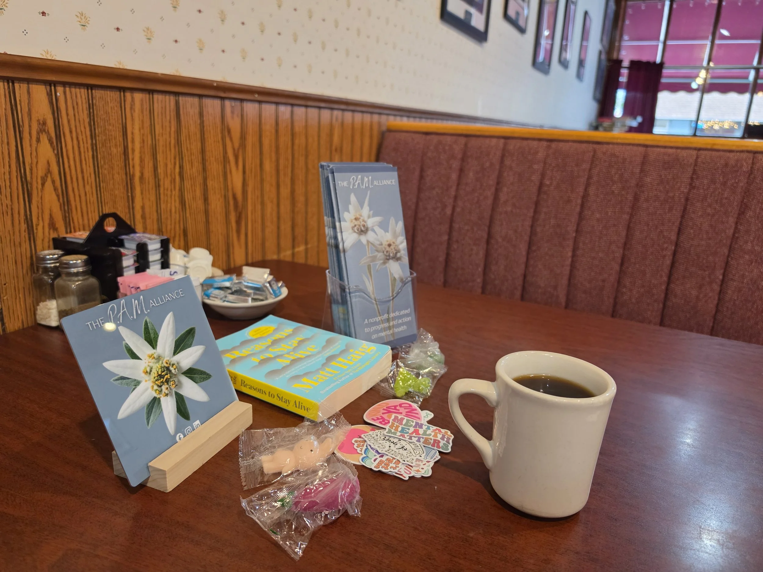 coffee, book and other items on cafe table