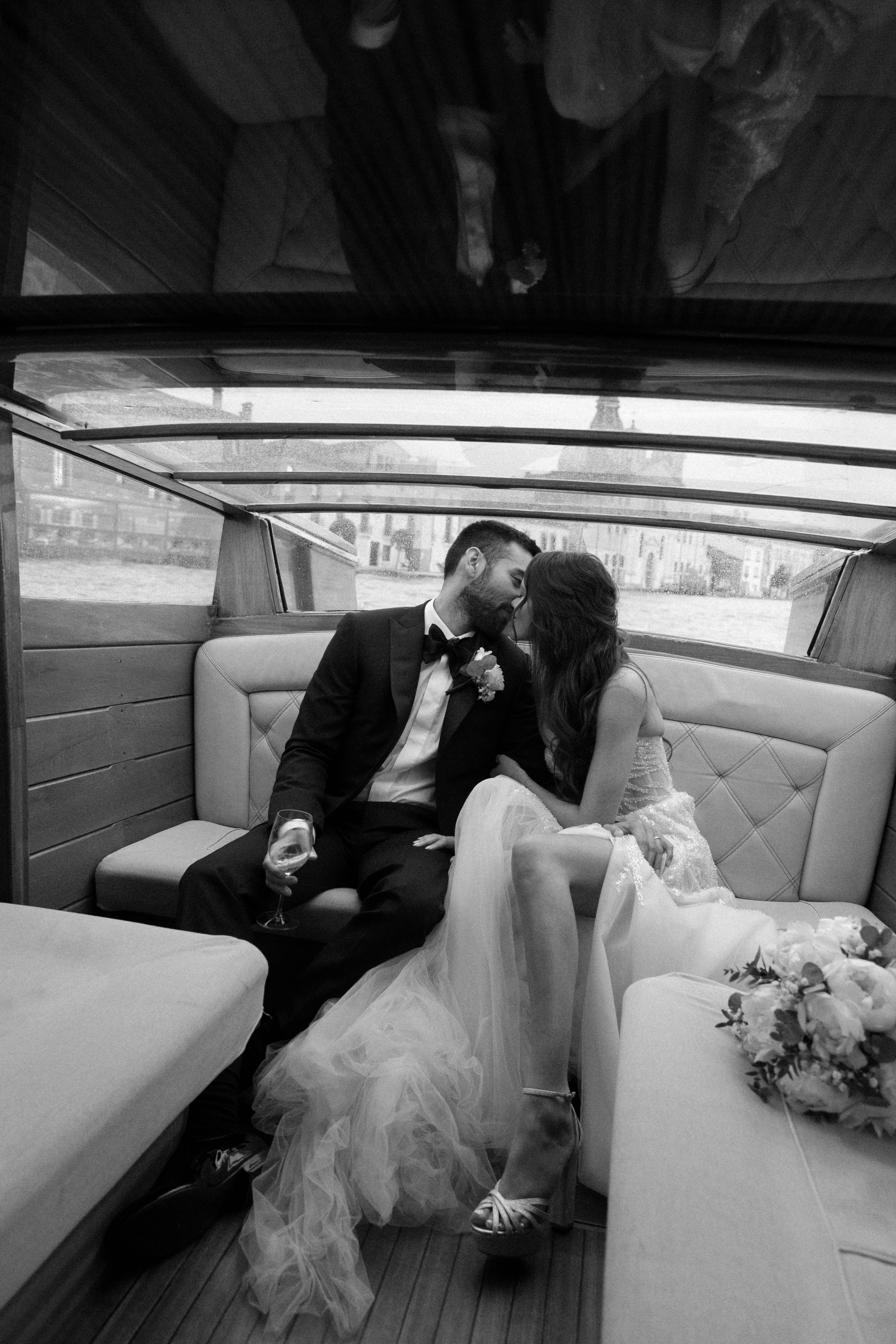 “Romantic Venice Italy destination wedding, private boat,  kiss with champagne toast”