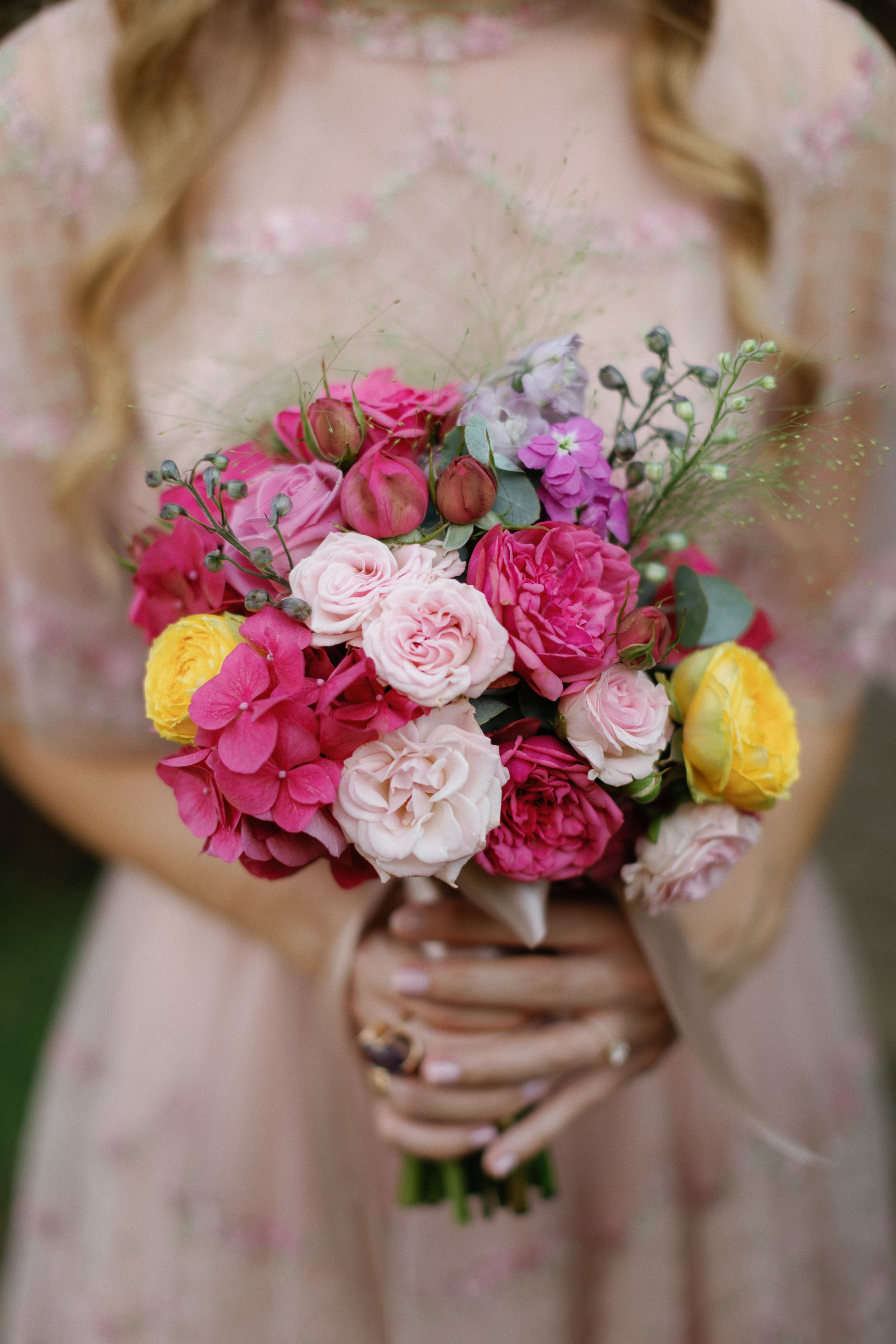 Bride holding a colorful wedding bouquet in Portofino, Italy for her destination wedding in Italy.