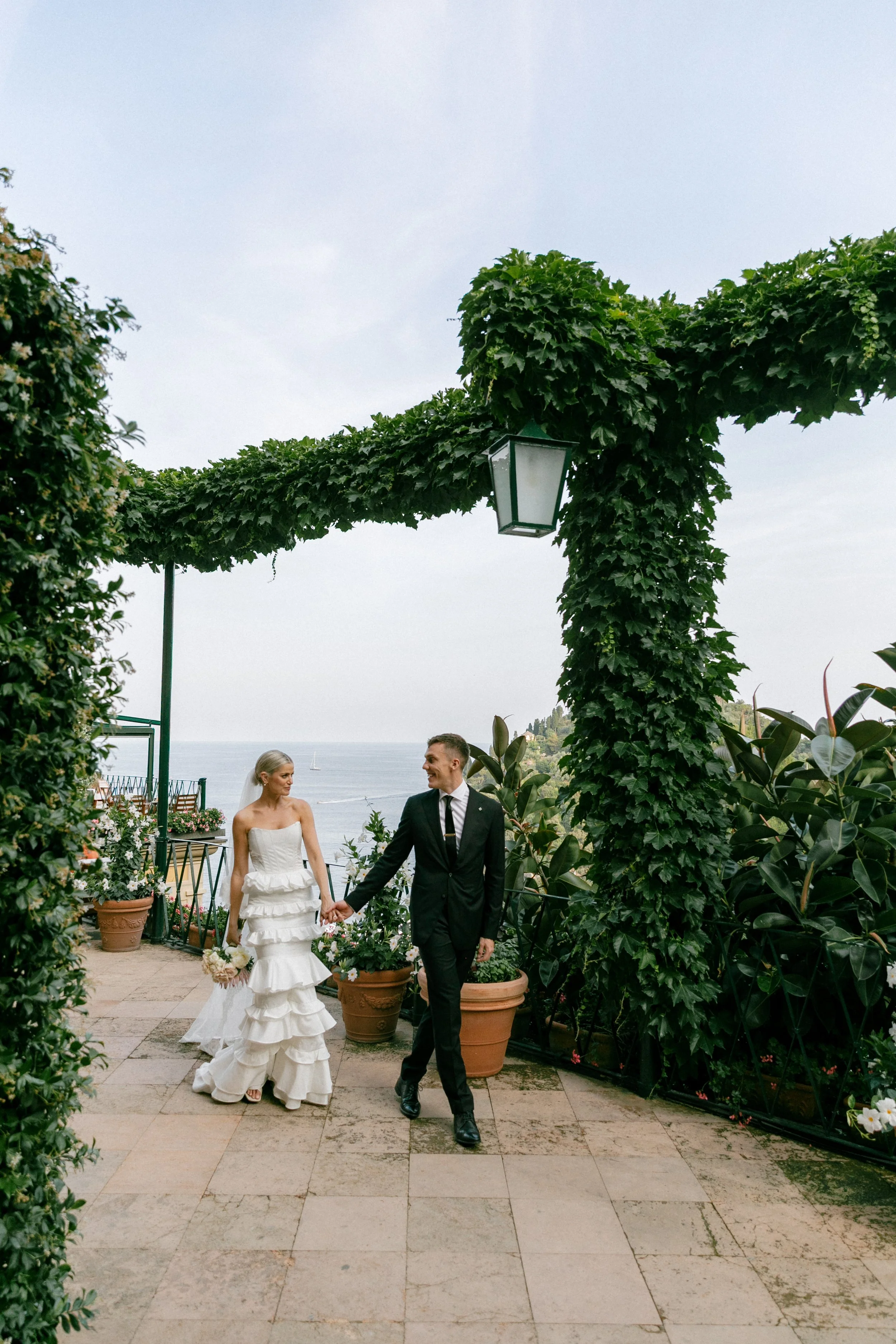 Couple walking along the terrace at the Hotel Splendido in Portofino, Italy.