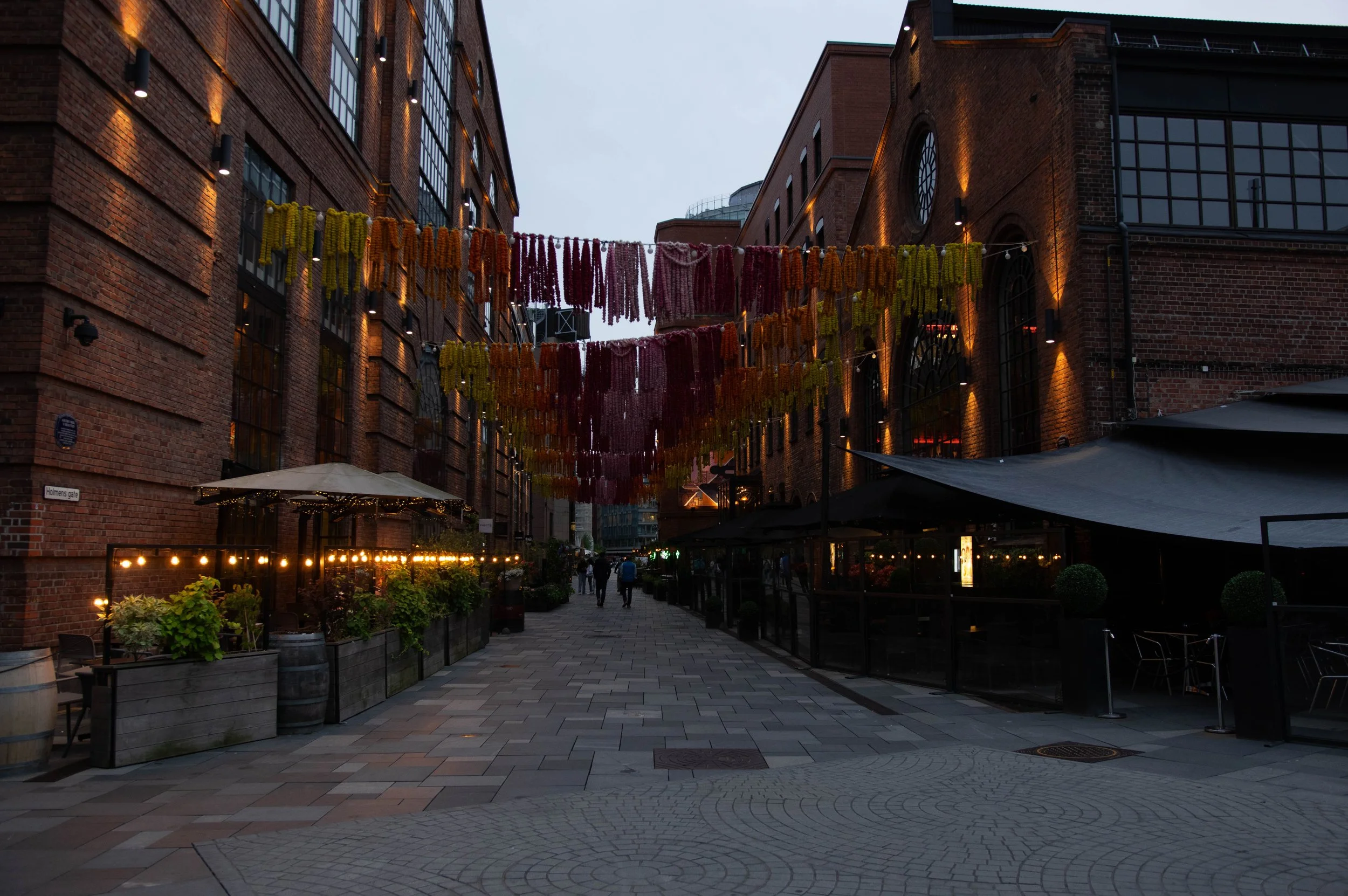 An alley in Aker brygge, and old shipping yard that has been converted into a luxurious area.