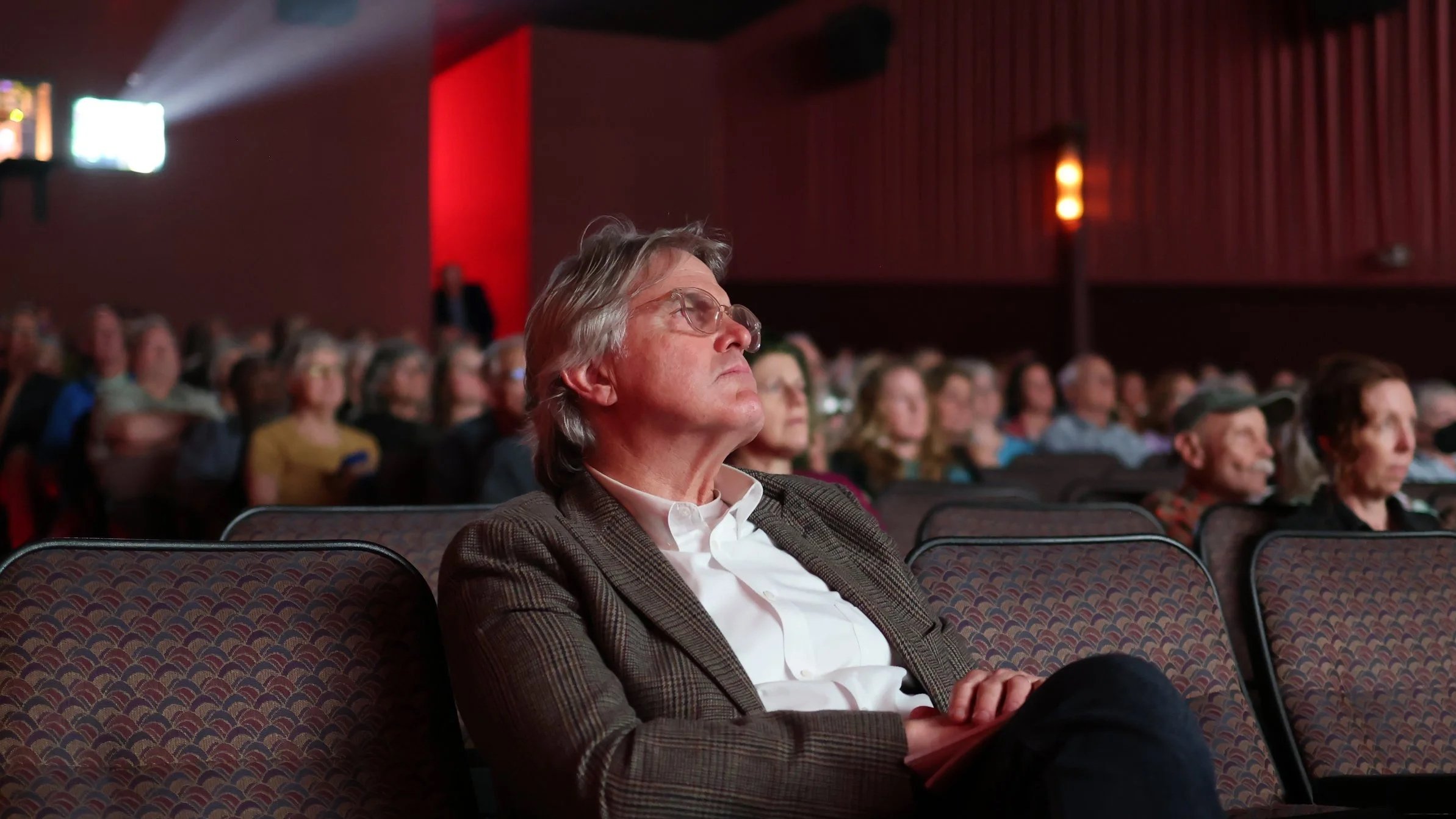 Audience watches "A Life Reimagined: The George Masa Story" at Asheville's Fine Arts Theater, April 29th, 2026