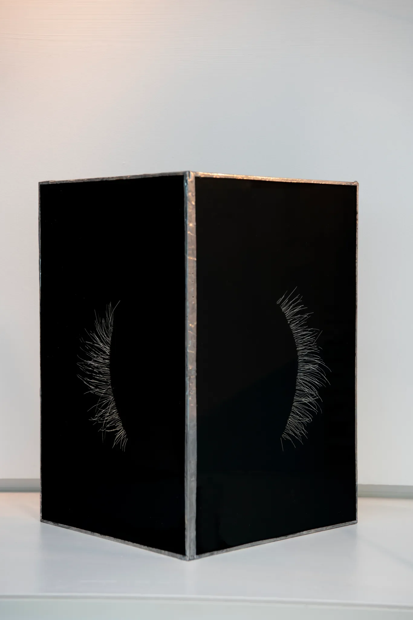 Glass, graphite spray, copper solder. Elviner &amp; Emerald’s sleeping lashes