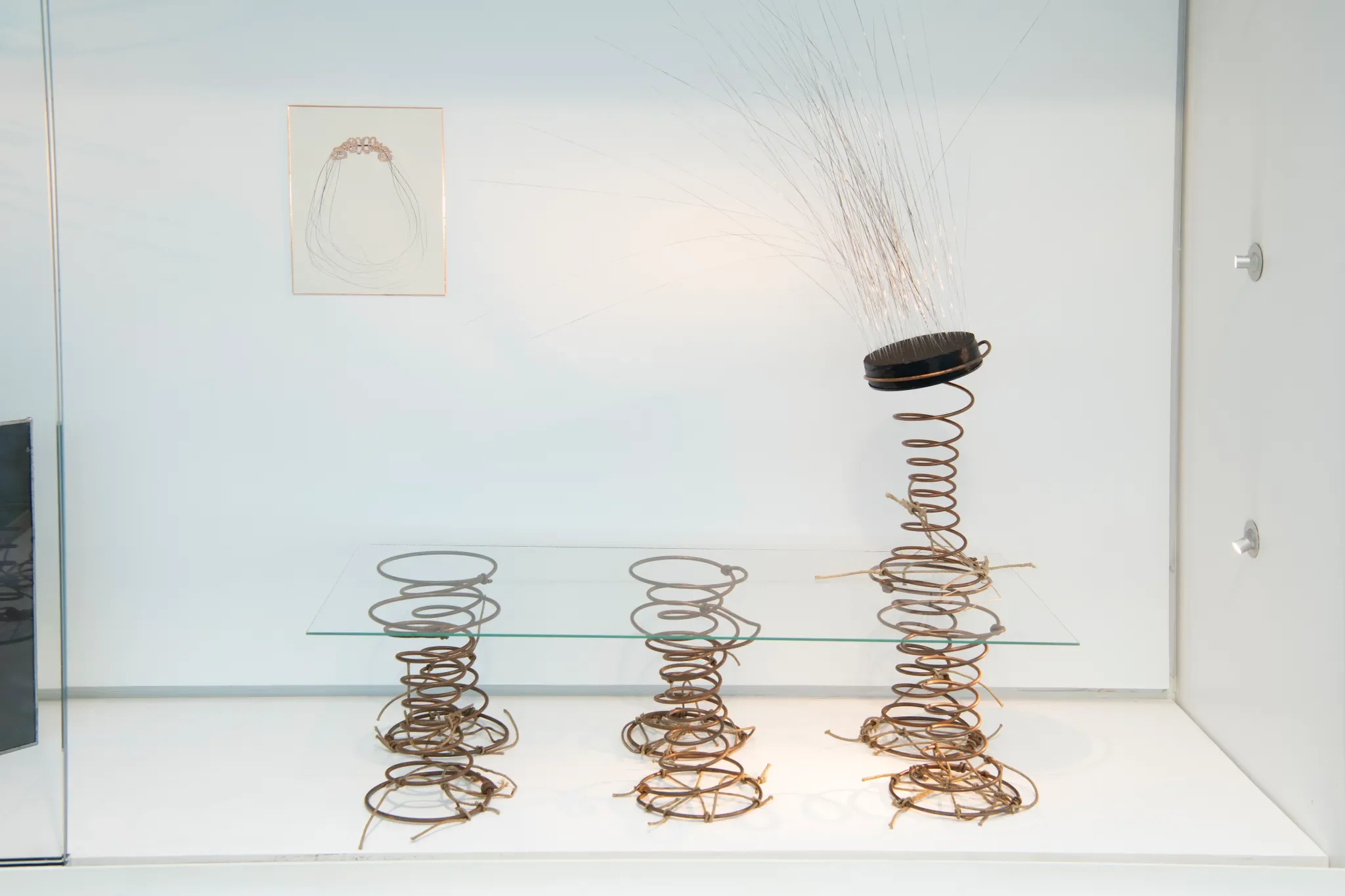 Salvaged springs, glass, soot, ribbon, perforated card