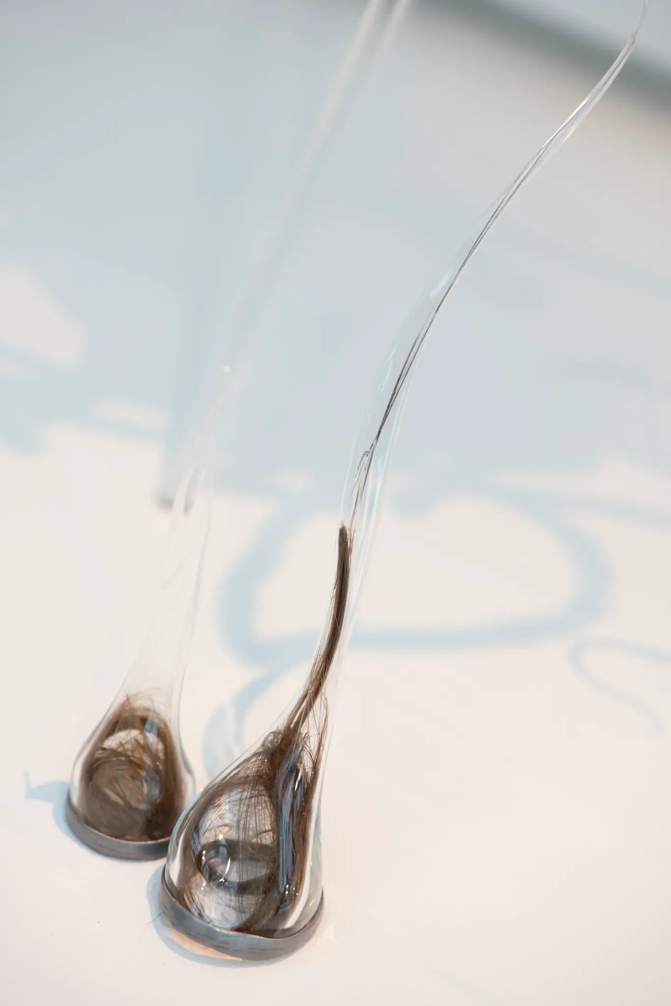 Salvaged borosilicate glass, lead, hair from my daughter’s first hair cuts