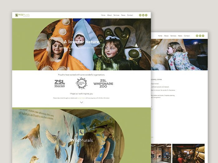 Screenshot of a website homepage for a nature and zoo organization, showing children in costumes and an indoor mural of flying birds.