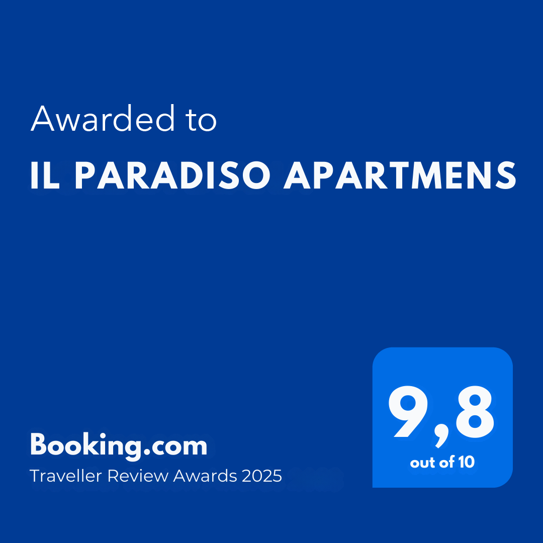 Blue award badge with white text stating it was awarded to IL Paradiso Apartments with a 9.8 out of 10 score, from Booking.com Traveller Review Awards 2025.