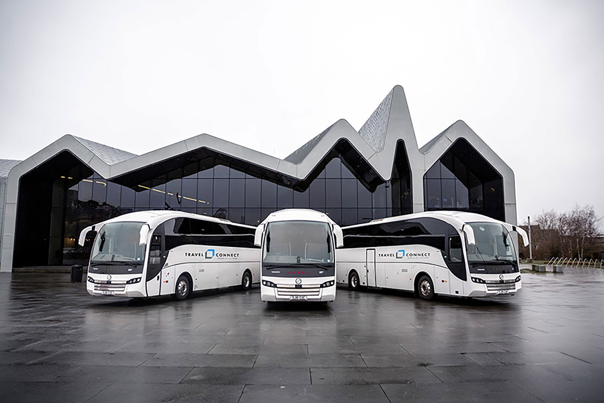 Luxury coaches in front of a museum