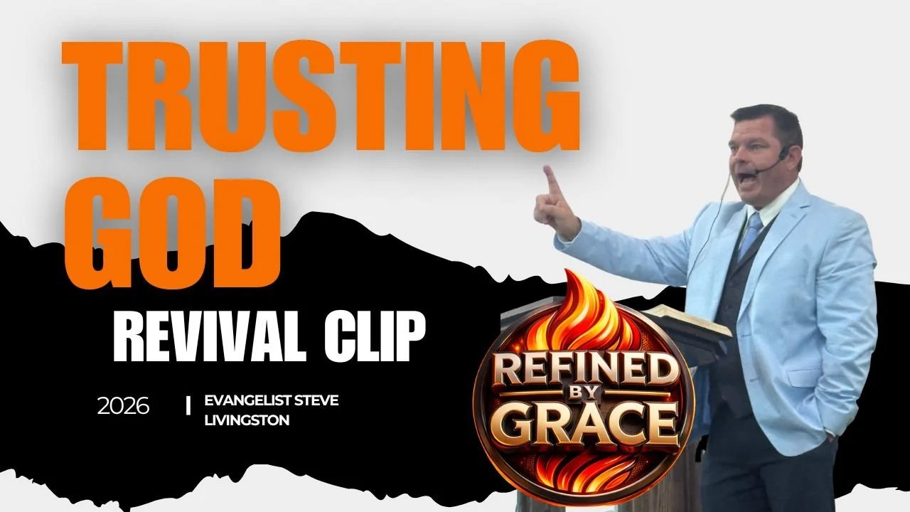 Speaker in a light blue suit giving a sermon or presentation at a podium with a microphone headset, behind a large graphic with the words "Trusting God" in orange and white, and the logo "Refined by Grace" with flames.