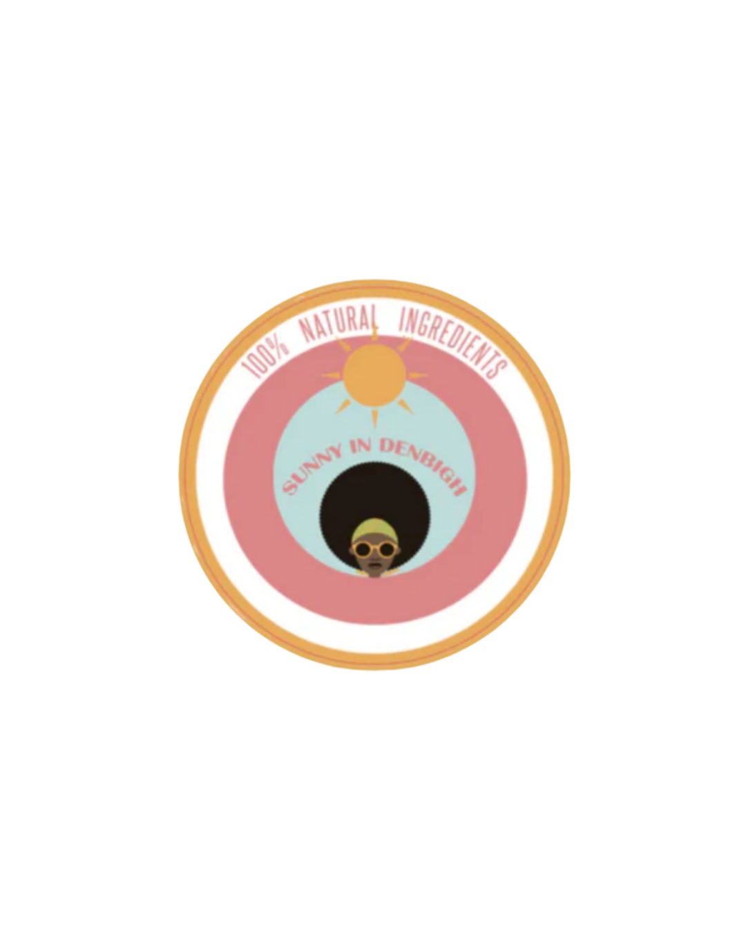 A round product label featuring a sun icon and a cartoon woman with large sunglasses, with phrases '100% Natural Ingredients,' 'Sunny in Denbigh,' and a colorful design.