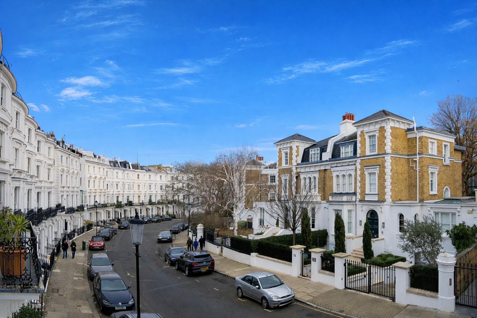 Elegant London residential street lined with white stucco and yellow-brick townhouses, parked cars, leafless trees, and a bright blue sky.