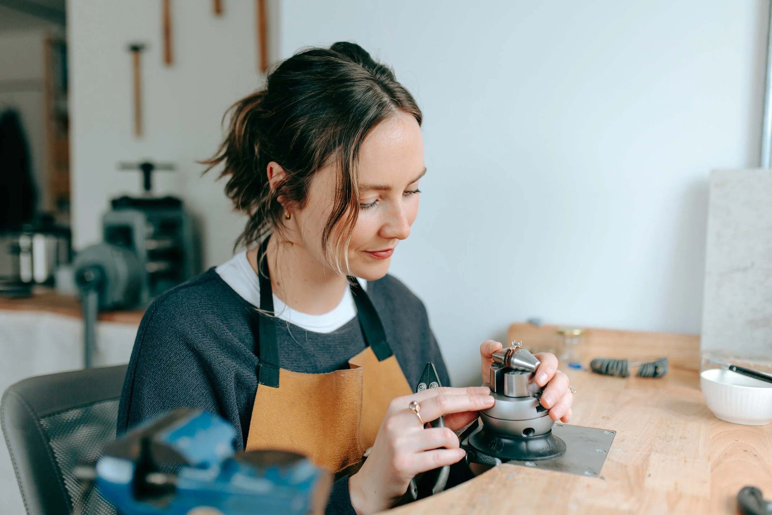 Josie working at the bench on bespoke gold ring in her Frome studio