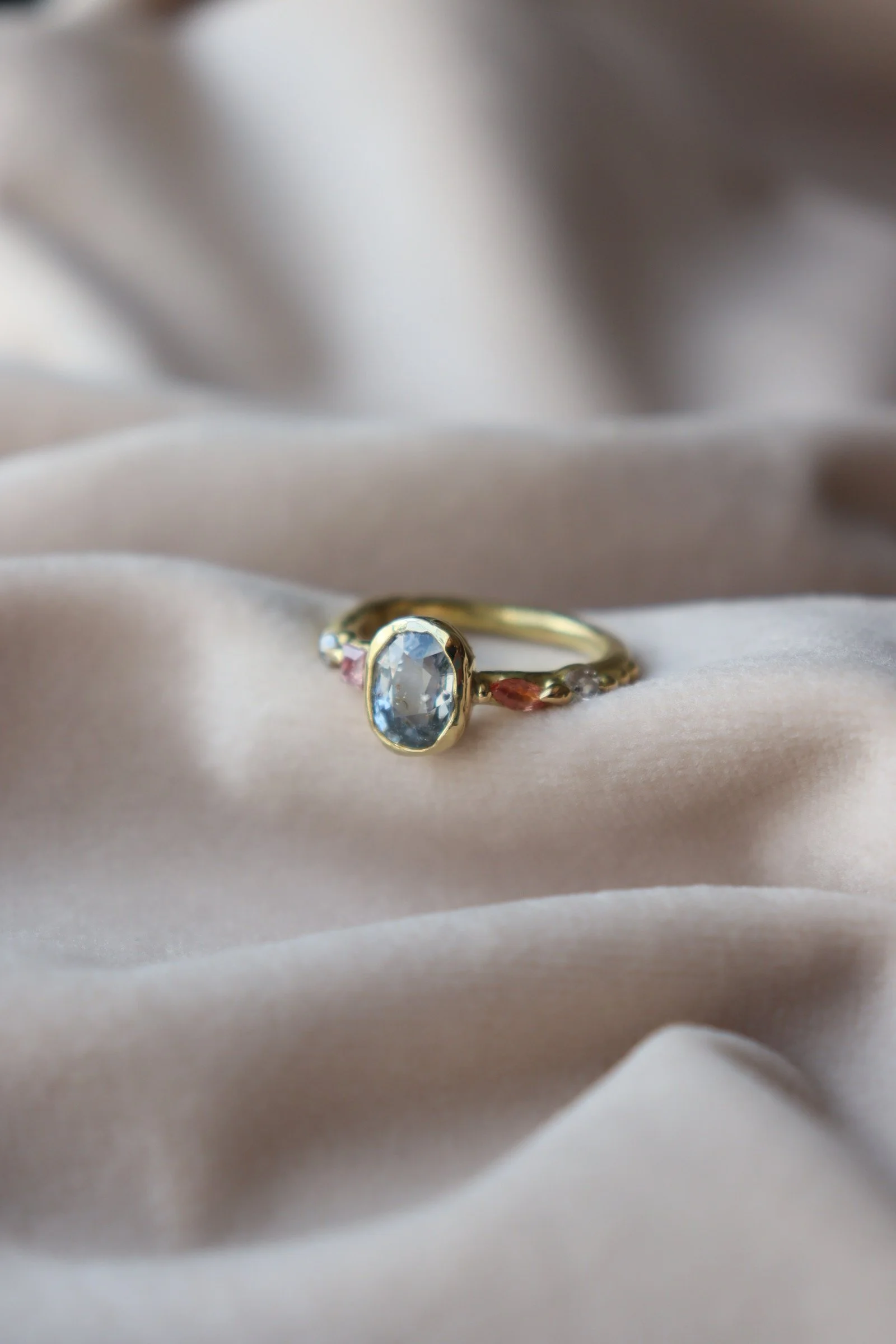 Bezel set Sapphire and diamond engagement ring