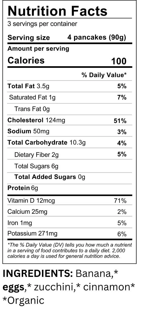 Nutrition facts label for pancakes, serving size 4 pancakes (90g), 100 calories, 3.5g fat, 124mg cholesterol, 50mg sodium, 10.3g total carbs, 2g dietary fiber, 6g total sugars, 0g added sugars, 6g protein, 12mcg vitamin D, 25mg calcium, 1mg iron, 271mg potassium. Ingredients include organic banana, eggs, zucchini, and cinnamon.