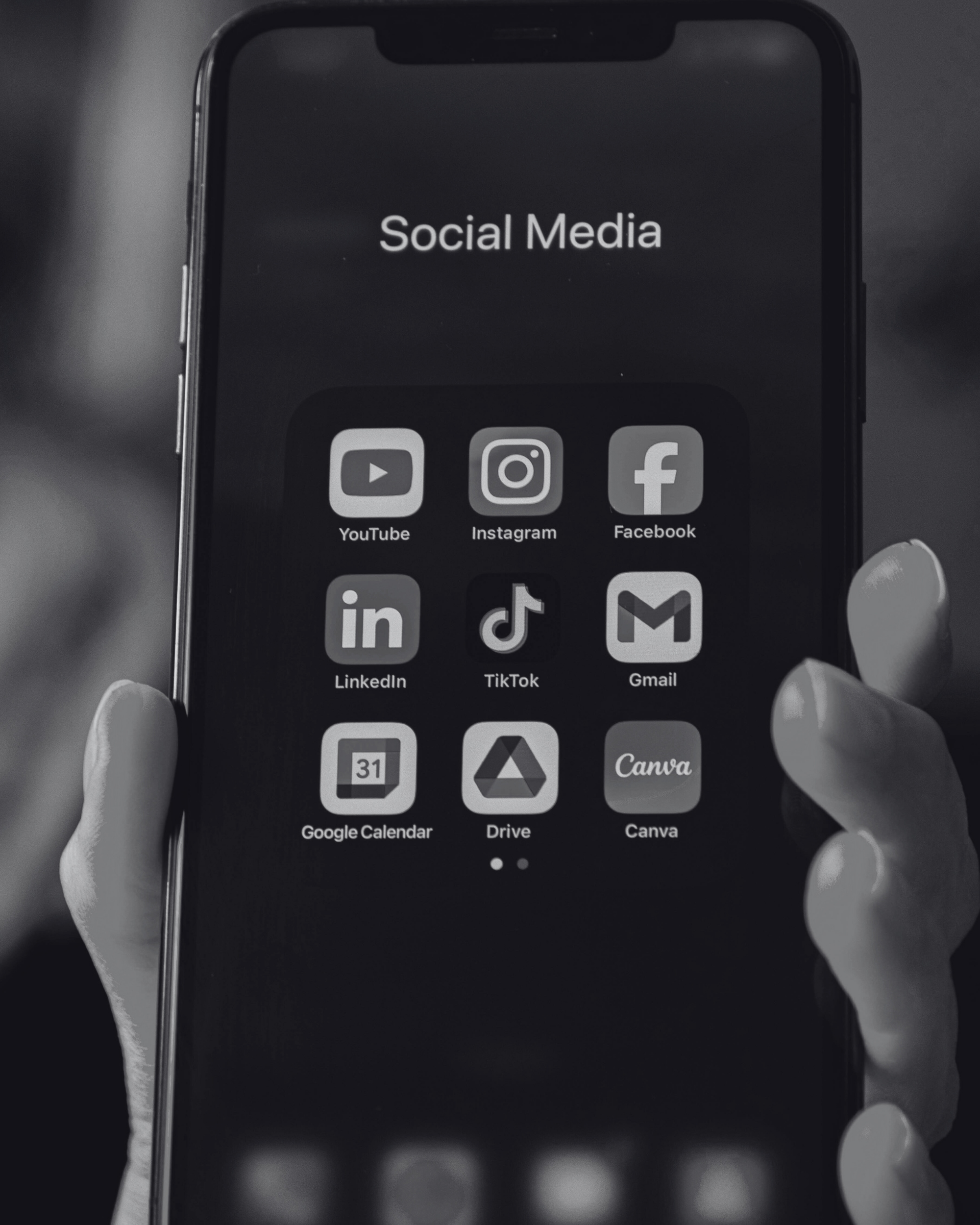 Close-up of a smartphone screen showing social media and digital tools including YouTube, Instagram, Facebook, LinkedIn, TikTok, Gmail, Google Drive, and Canva, representing digital marketing services by Seven4 Marketing.