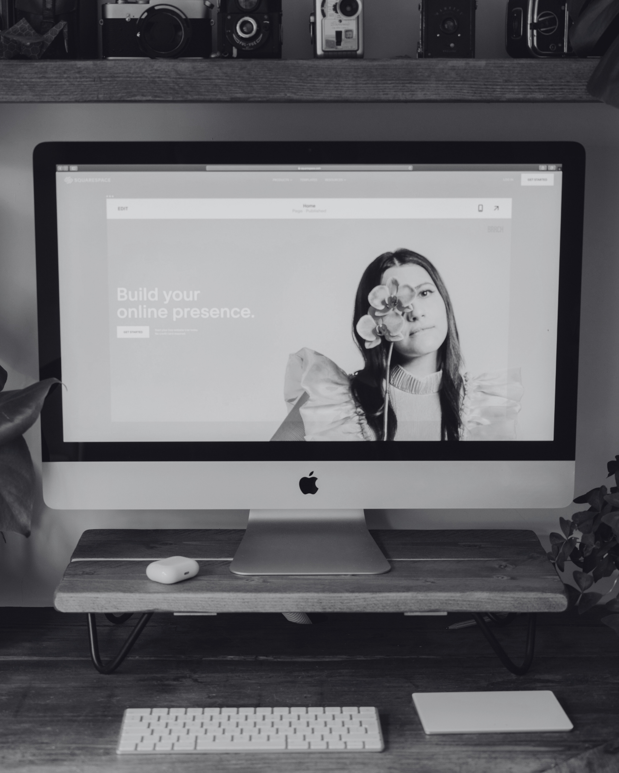 Desktop computer displaying a website editor with the text Build your online presence, representing website design and SEO services by Seven4 Marketing.