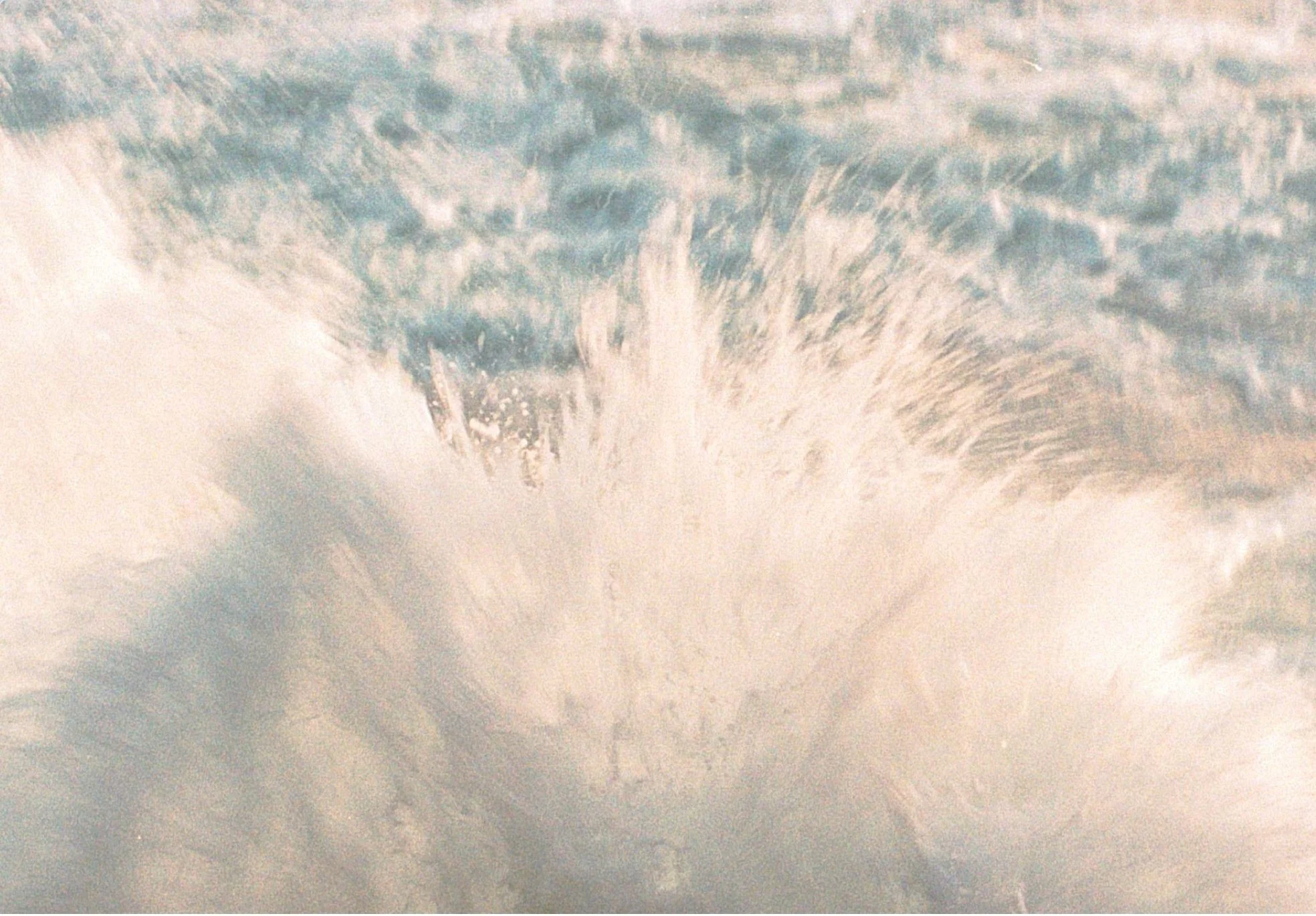Close-up of a powerful ocean wave with water splashing and cresting.
