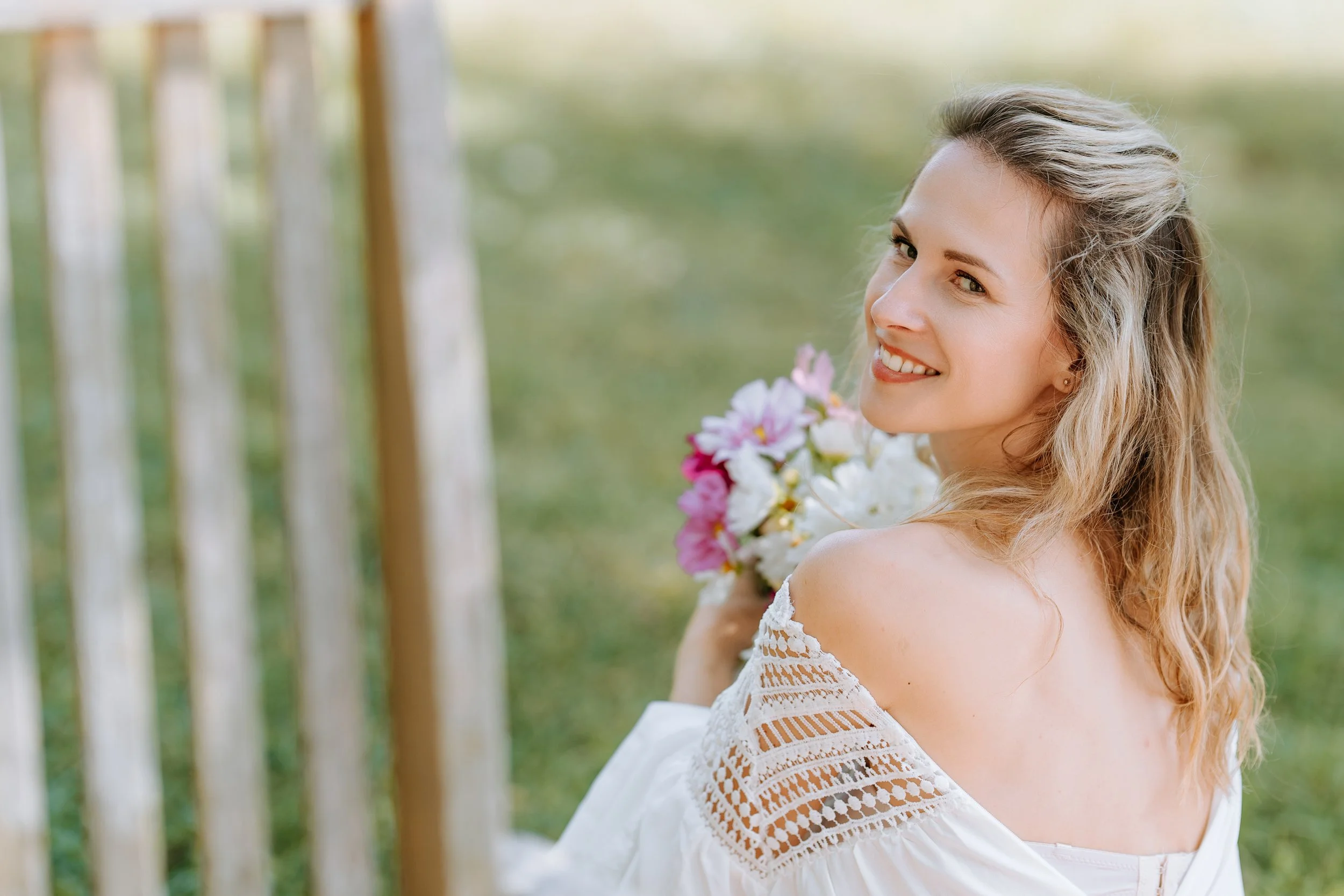 Laurie’s customers, Fernando and Kate embracing by the lake on their wedding day.