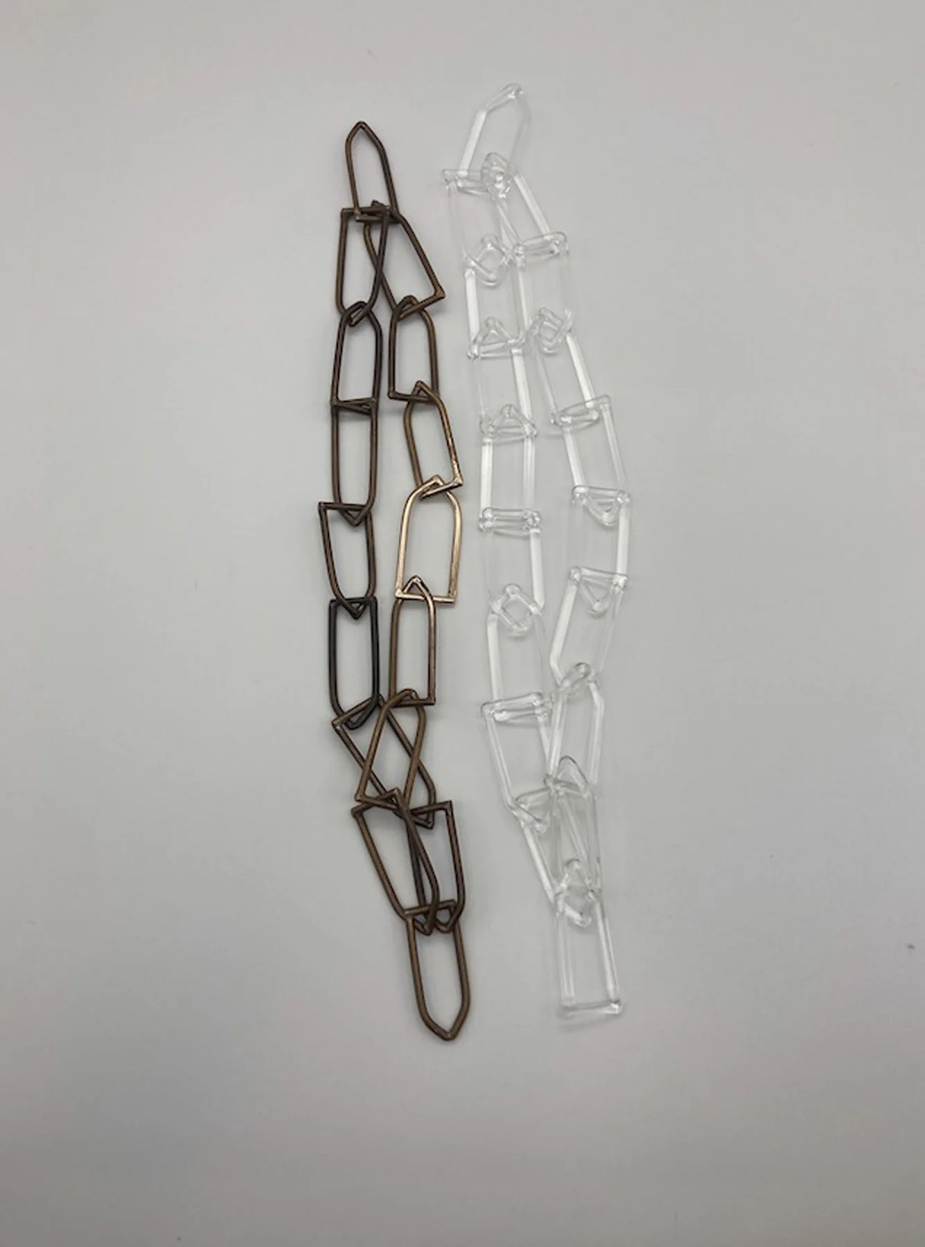  Untitled , Pair of chains, 2022 Bronze and glass 